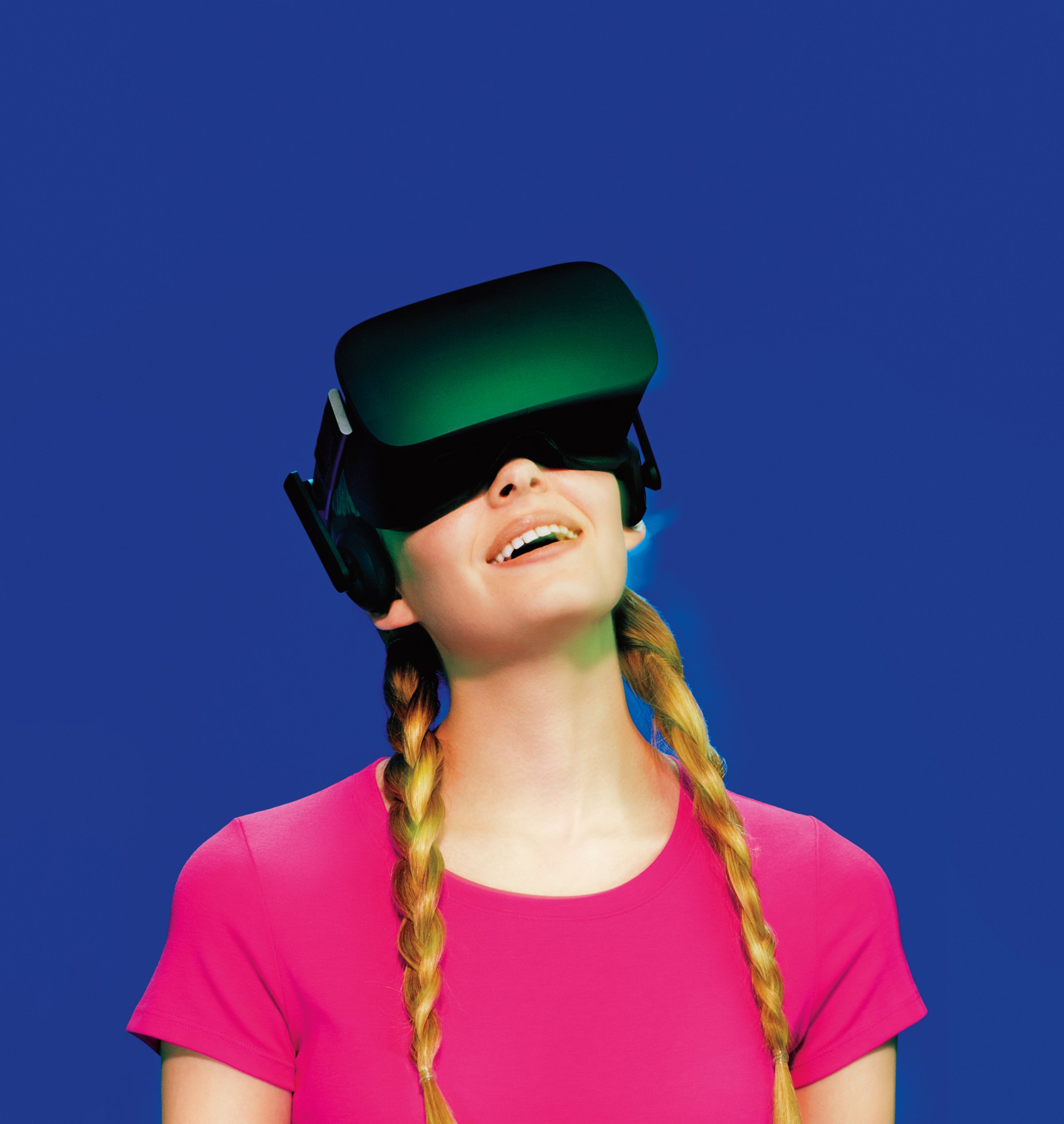 A young woman wearing Oculus Rift virtual reality goggles