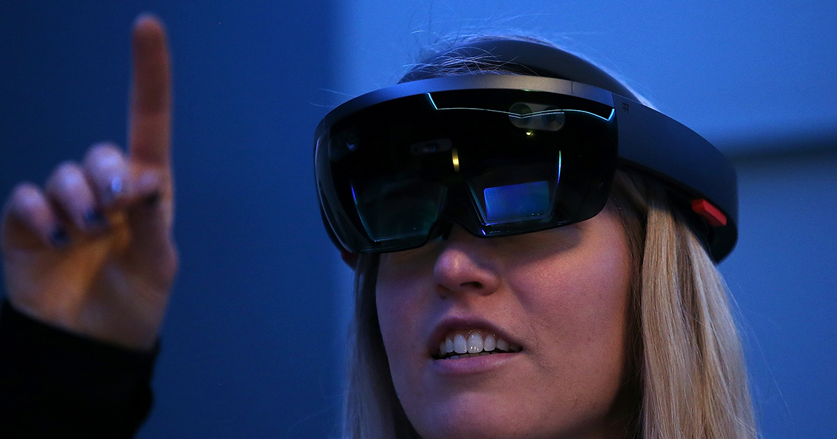 Microsoft employee Gillian Pennington demonstrates the Microsoft HoloLens augmented reality (AR) viewer during the 2016 Microsoft Build Developer Conference on March 30, 2016 in San Francisco, California.