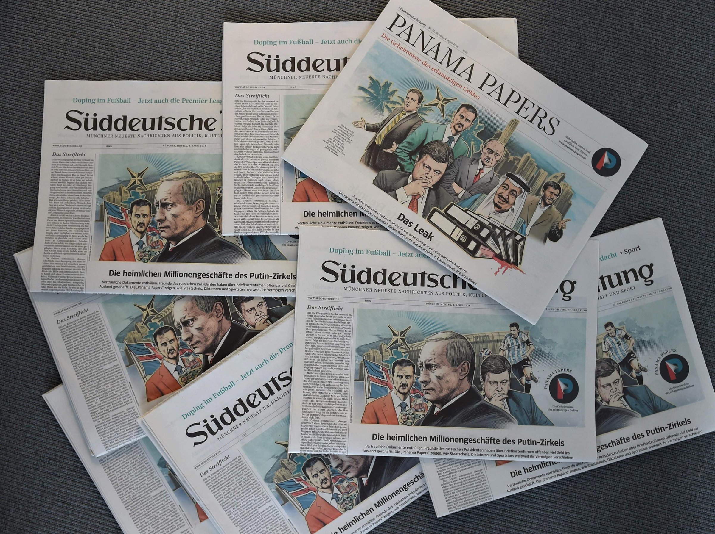 Issues of the German daily Sueddeutsche Zeitung, featuring illustrations of leaders including Russian President Vladimir Putin by Peter M Hoffmann, are seen at the newspaper's office in Munich, Germany, April 7, 2016.