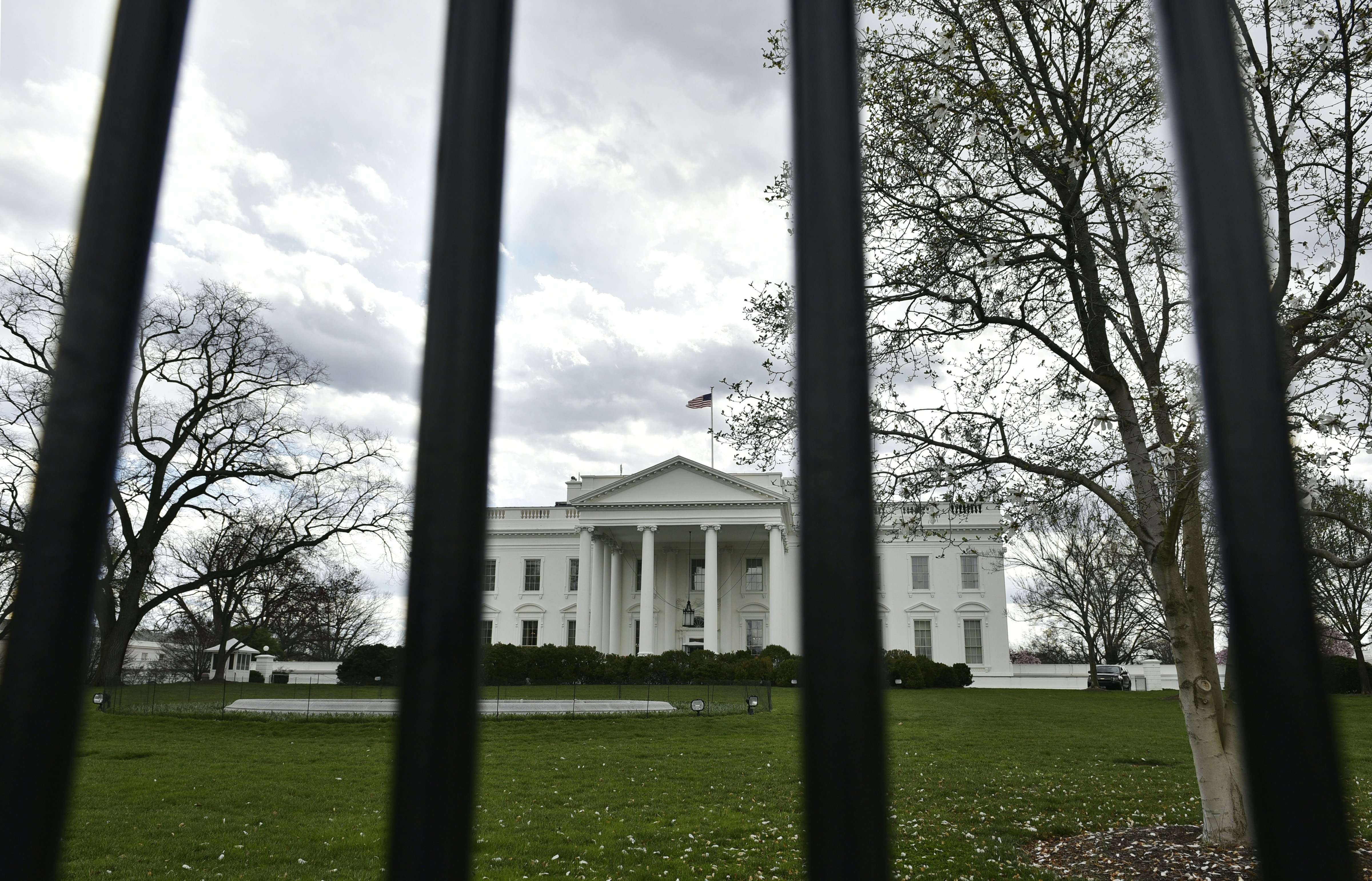 The White House is seen through the fence on March 17 in Washington, DC. (Mandel Ngan—AFP/Getty Images)