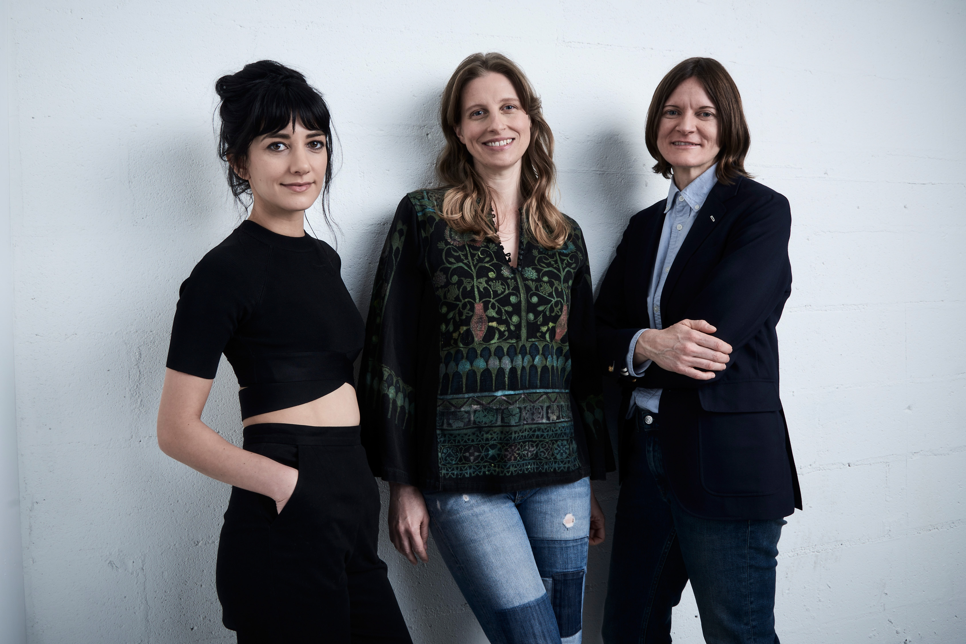 Actress Sheila Vand, actress Ann Carr, and director Ingrid Jungermann from 'Women Who Kill' pose at the Tribeca Film Festival Getty Images Studio on April 15, 2016 in New York City