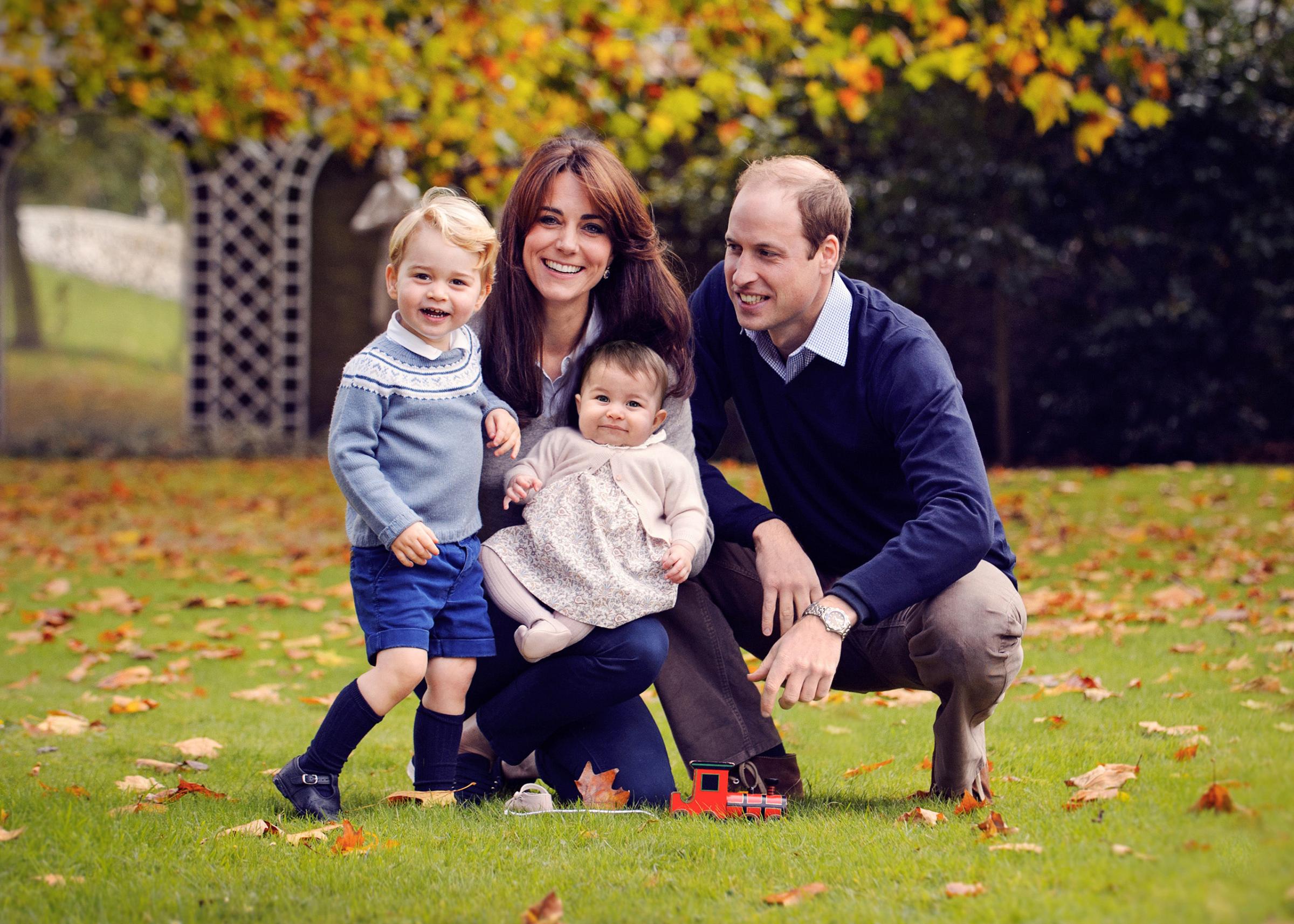 The Duke and Duchess of Cambridge with their two children, Prince George and Princess Charlotte, at Kensington Palace in London, Dec. 29, 2015.