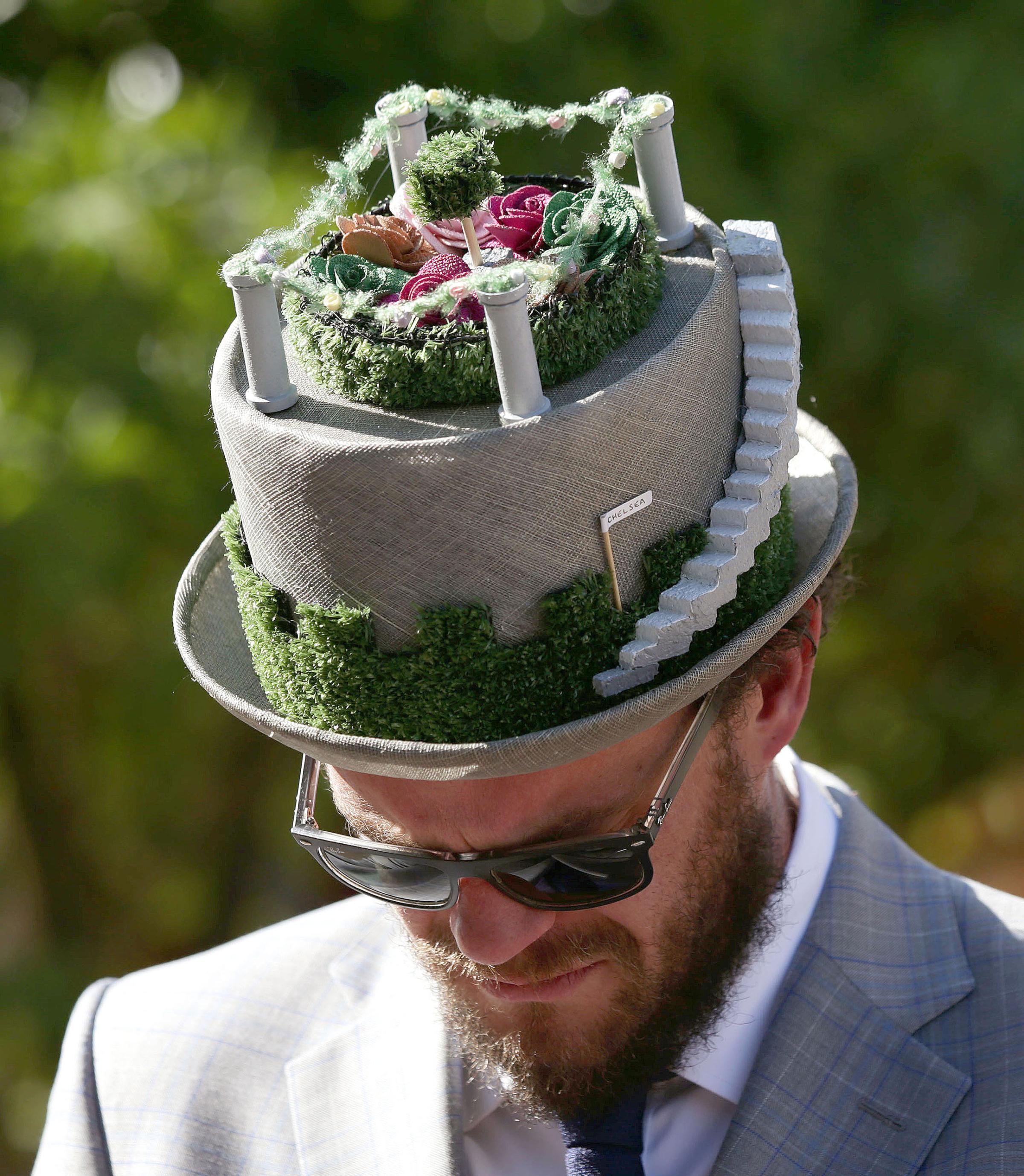Visitor Michael Conway wears a floral hat during a press day ahead of the Chelsea Flower Show at the Royal Hospital Chelsea in London, May 23, 2016.