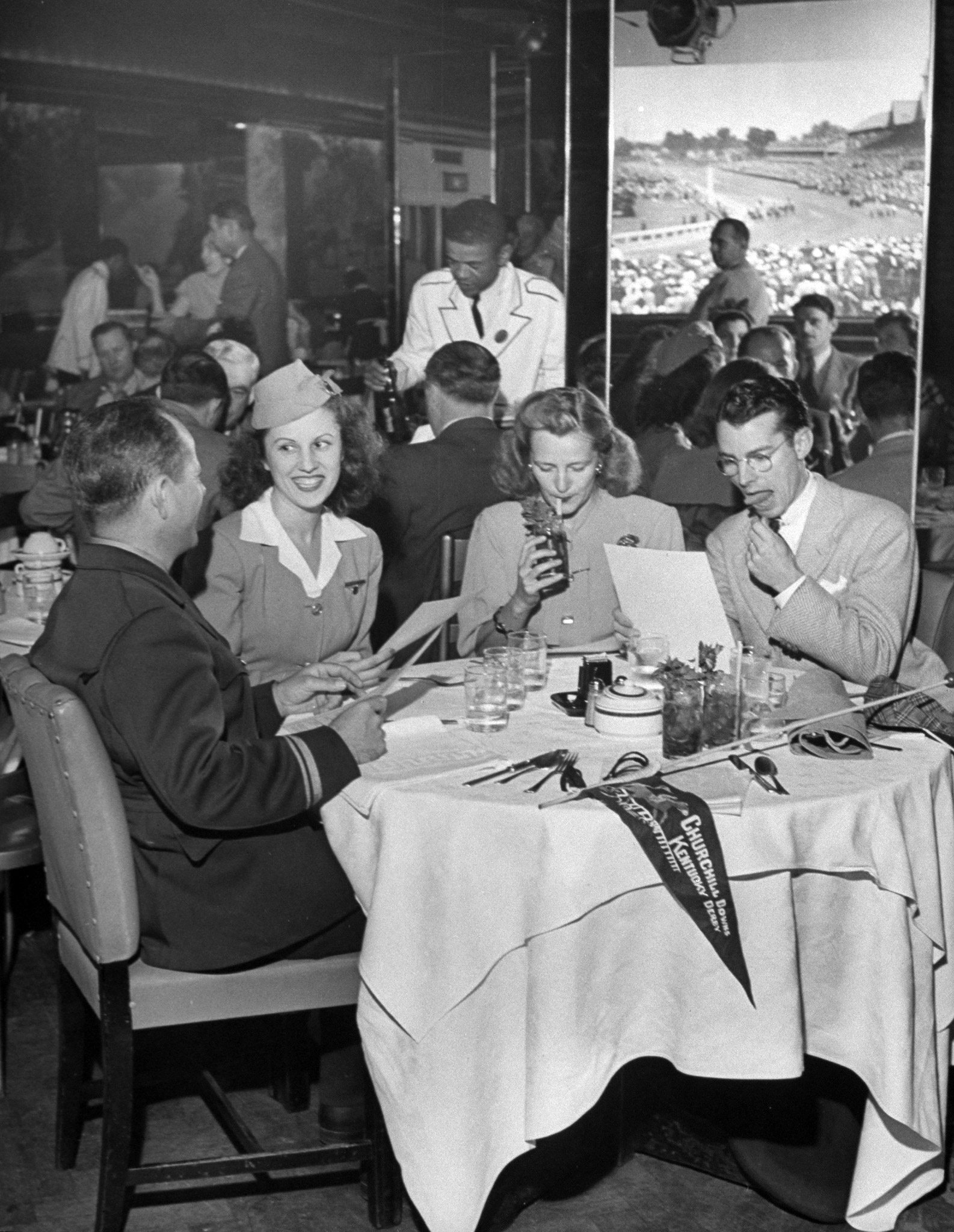 Fans eating in restaurant at the Kentucky Derby, 1946.