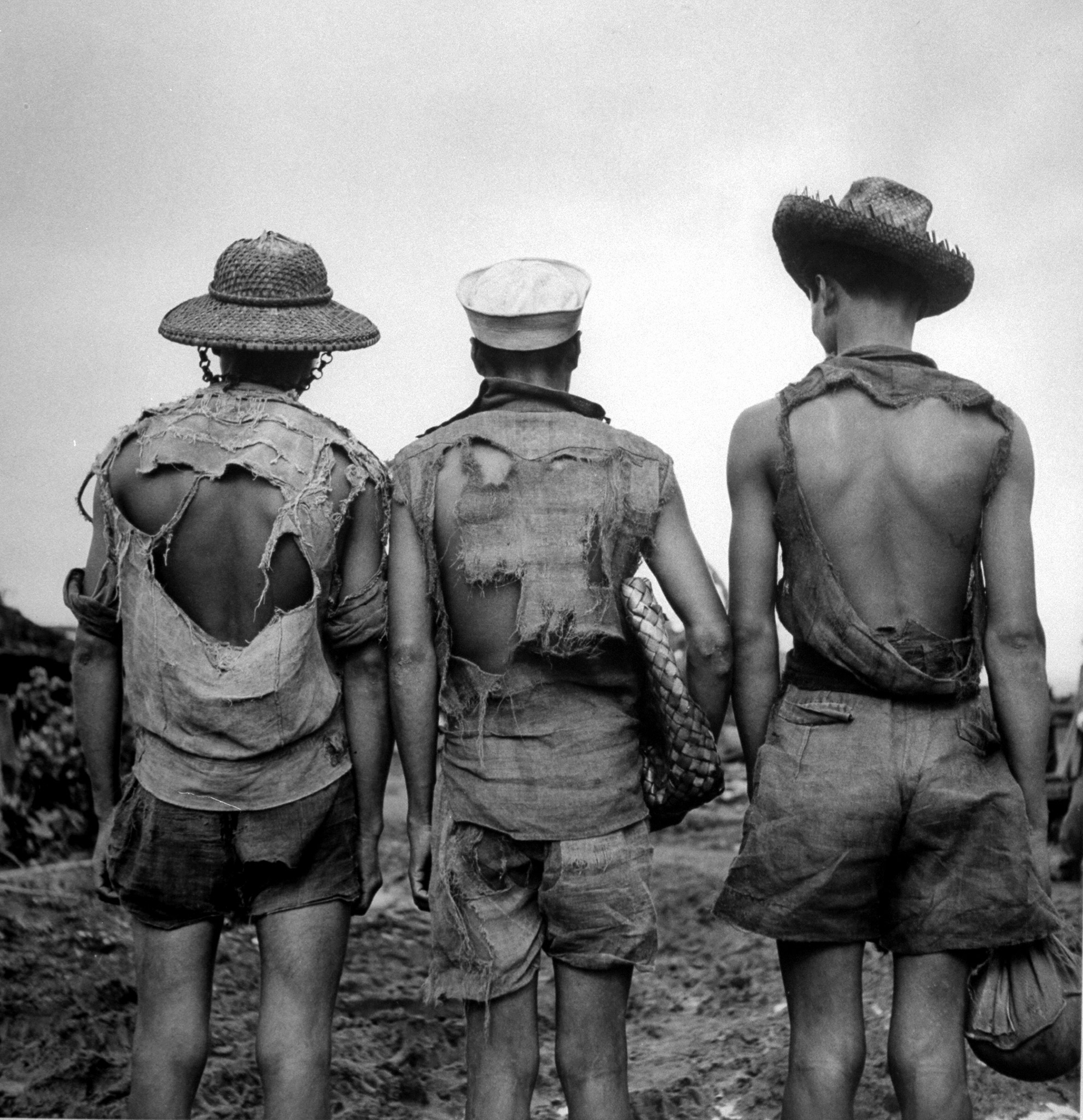 Filipinos wearing burlap clothing. This image appeared in the January 22, 1945 photo essay: The Battle Begins for Luzon.