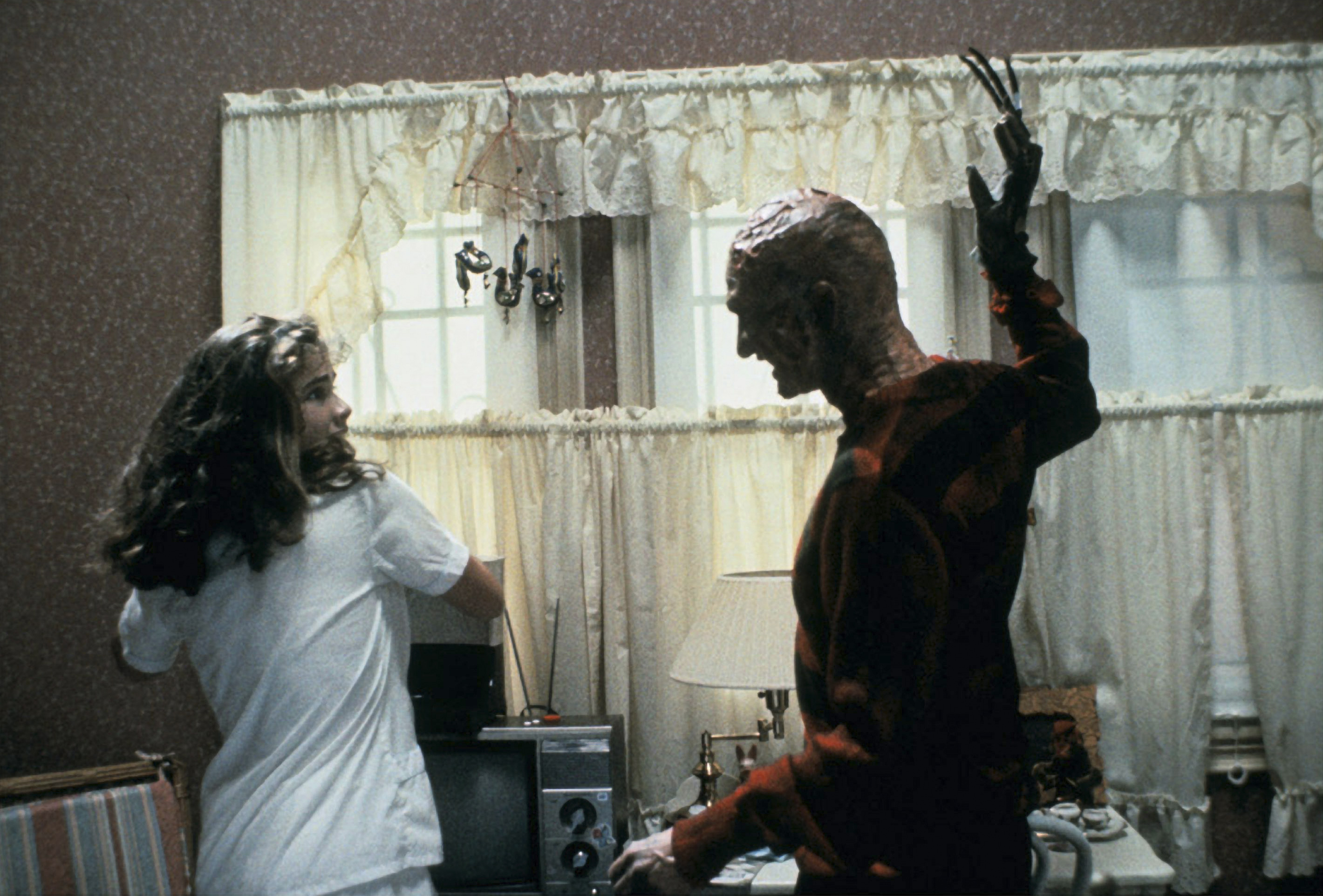 Heather Langenkamp as Nancy Thompson and Robert Englund as Freddy Krueger in 'A Nightmare on Elm Street' (New Line Cinema)