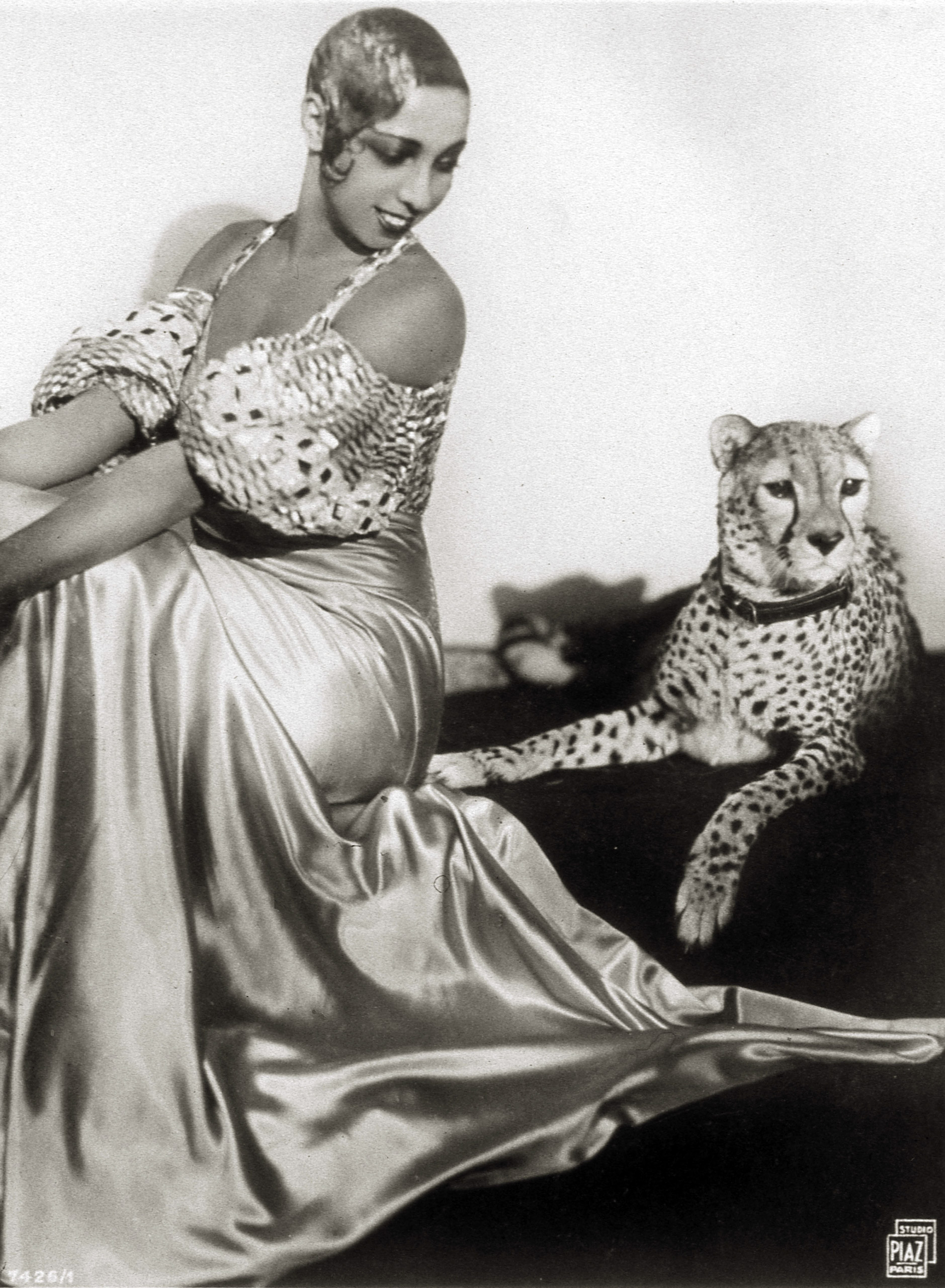 Josephine Baker sits with her pet cheetah, Chiquita, 1931.