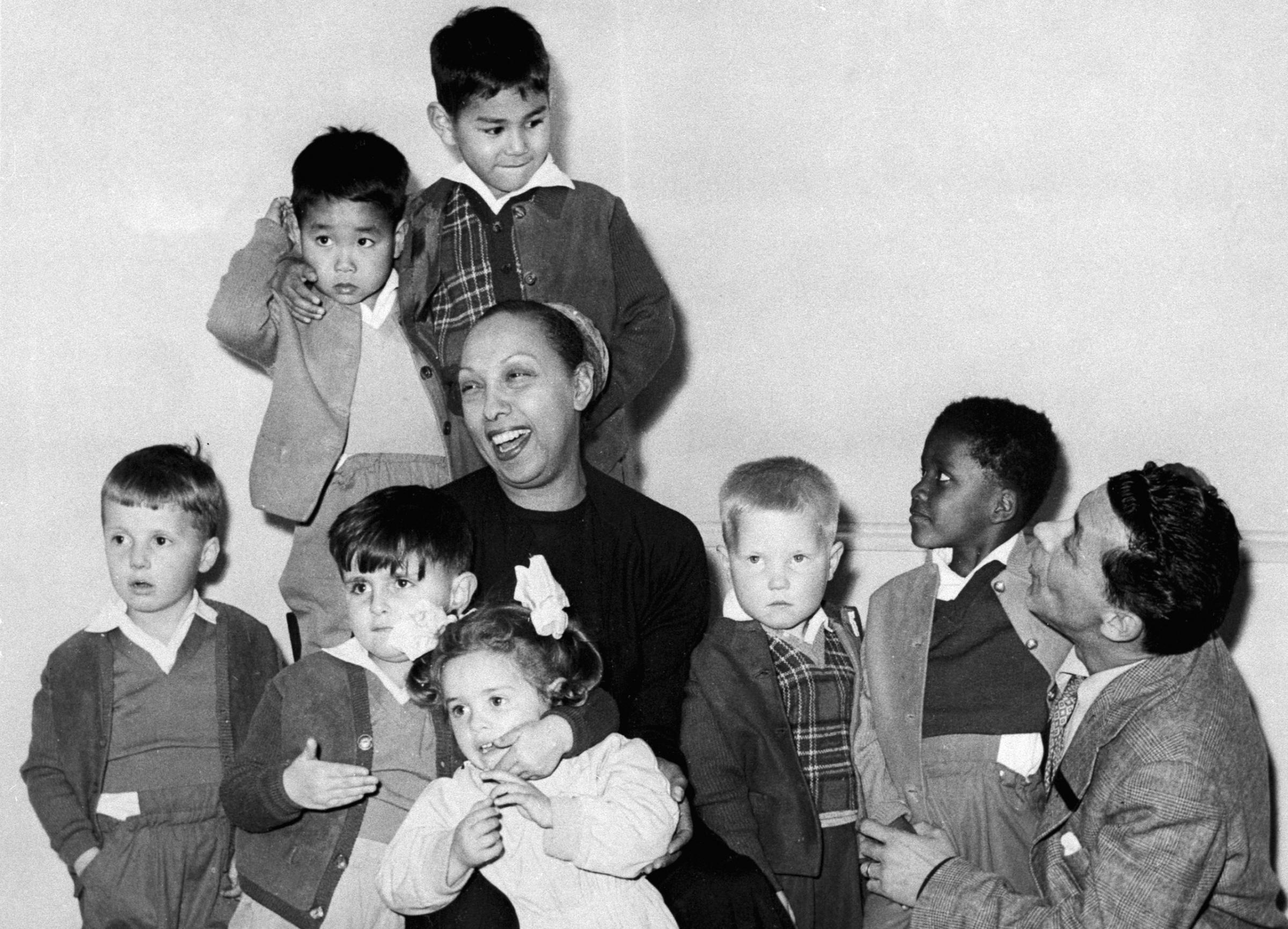 Singer Josephine Baker with her husband Joe Bouillon and their eleven adopted children at their home in Les Milandes, France. 1964.