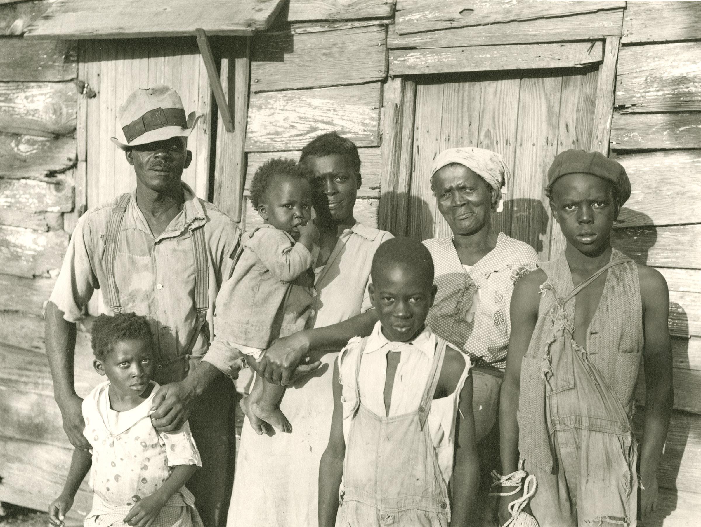 Rehabilitation client and his family on Lady's Sound off Beaufort, SC, 1936.