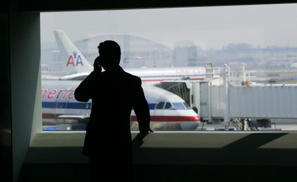A man talks on a cell phone in the new American Airlines terminal at John F. Kennedy International Airport in New York City, July 27, 2005.