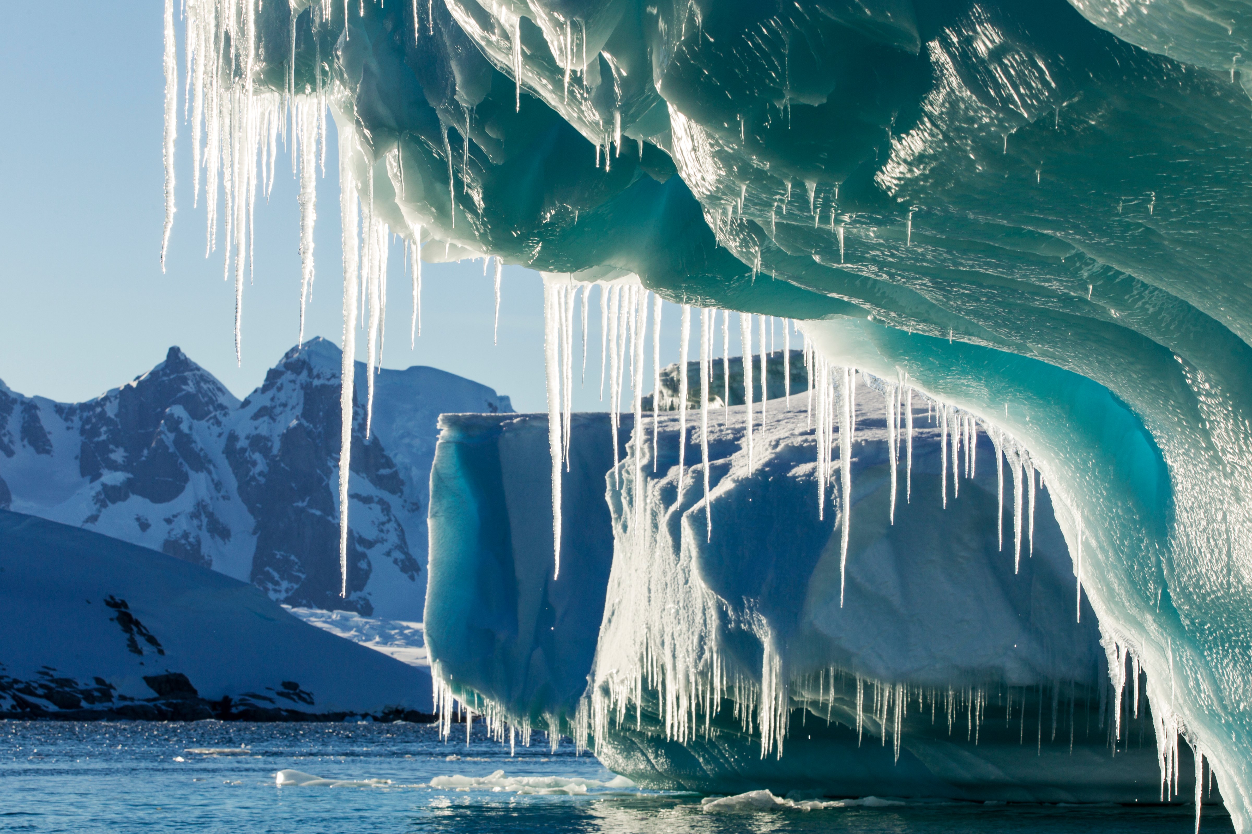 Antarctica, Petermann Island, Icicles hang from melting iceberg near Lemaire Channel (Paul Souders_Getty Images)