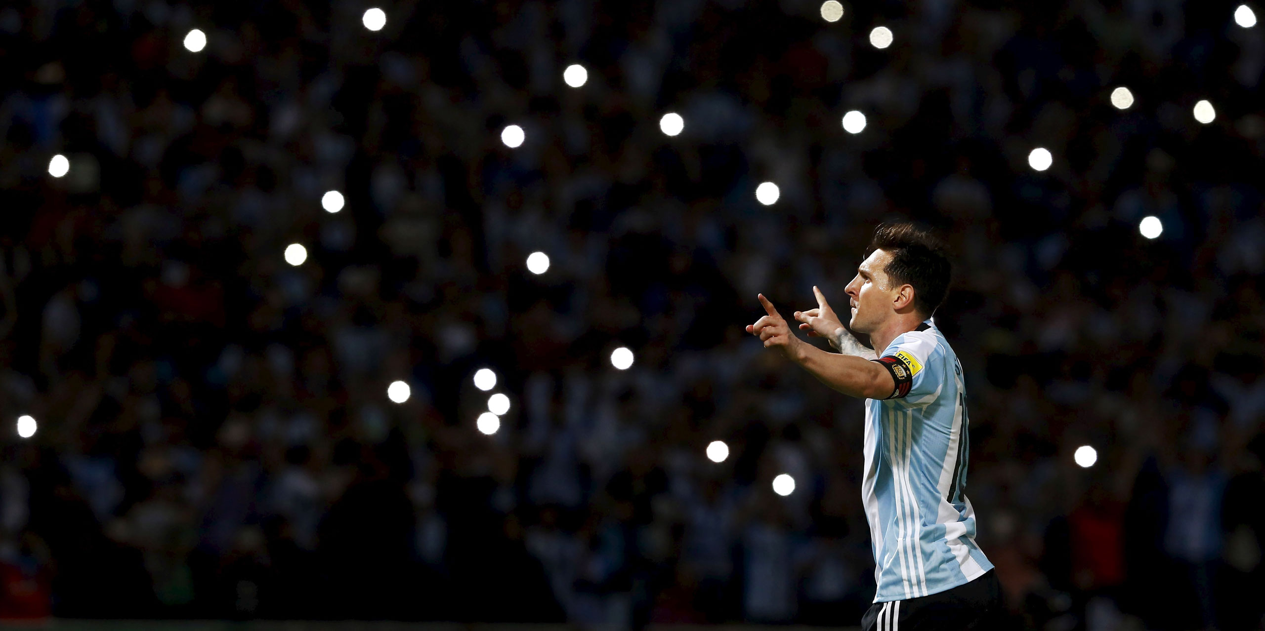 Messi celebrates after scoring a goal for Argentina in a March 29 World Cup qualifying match against Bolivia (Enrique Marcarian—REUTERS)