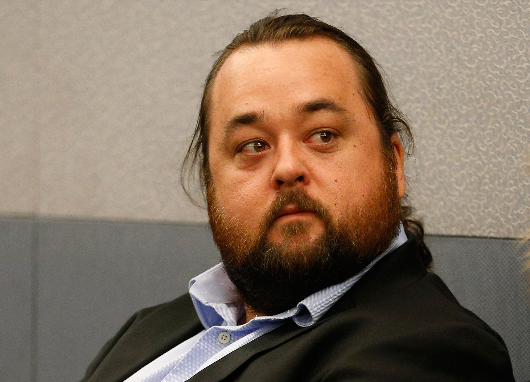 Austin Lee Russell, better known as Chumlee from the TV series "Pawn Stars," appears in court Monday, May 23, 2016, in Las Vegas. Russell and his lawyers told a Las Vegas judge he intends to plead guilty in state court to felony weapon and misdemeanor attempted drug possession charges. (AP Photo/John Locher)