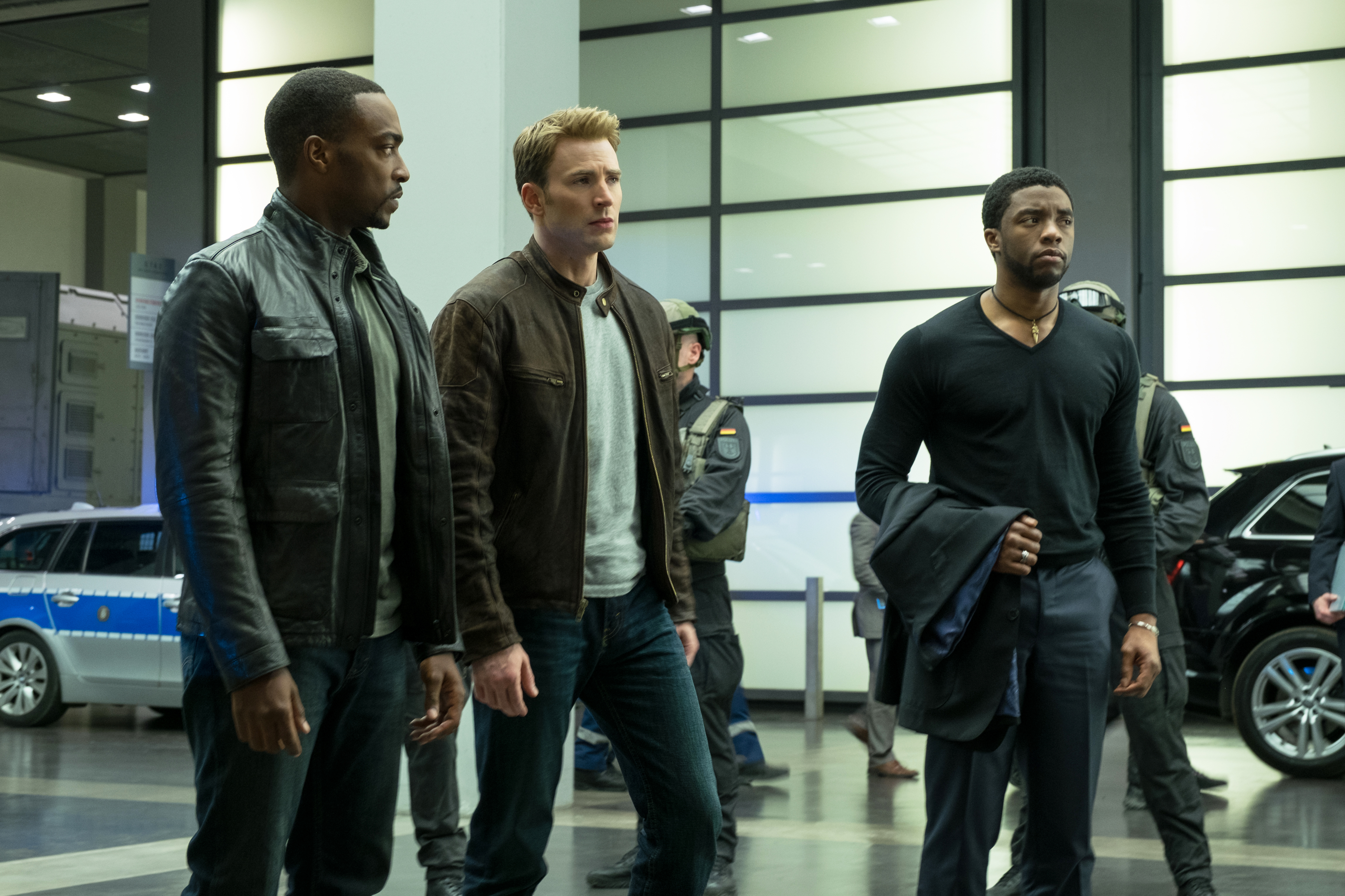 Chadwick Boseman as T'Challa talks with Captain America and Falcon in Captain America: Civil War