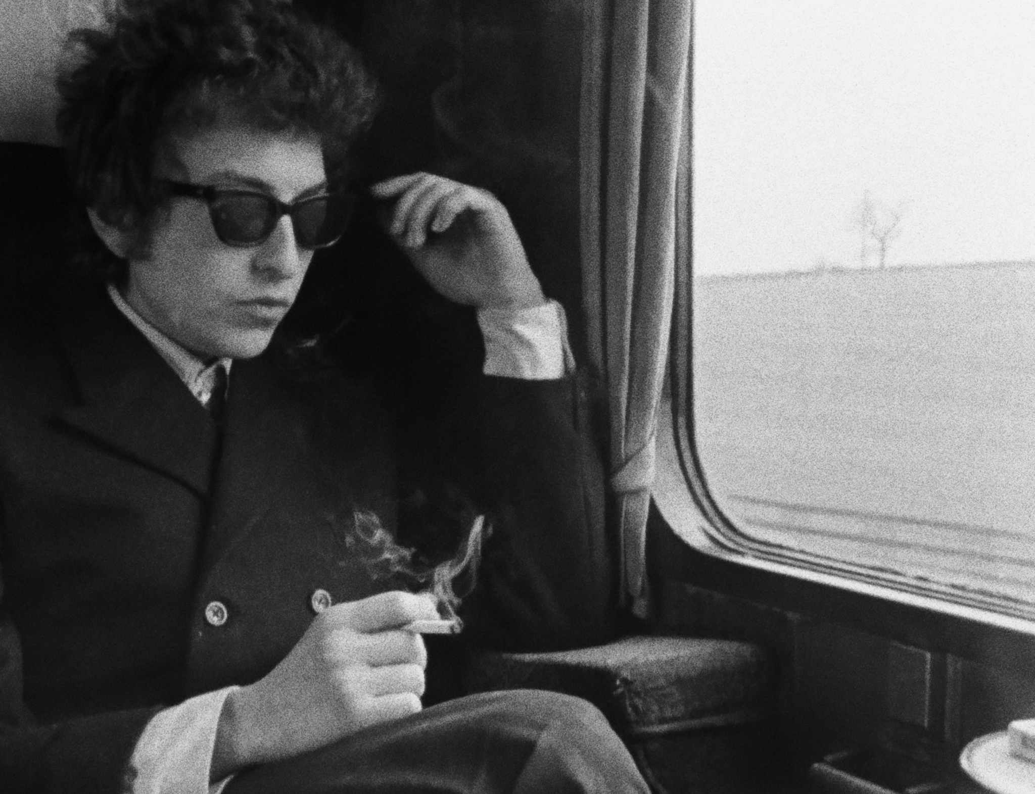 Bob Dylan en route to Manchester, England, 1965.