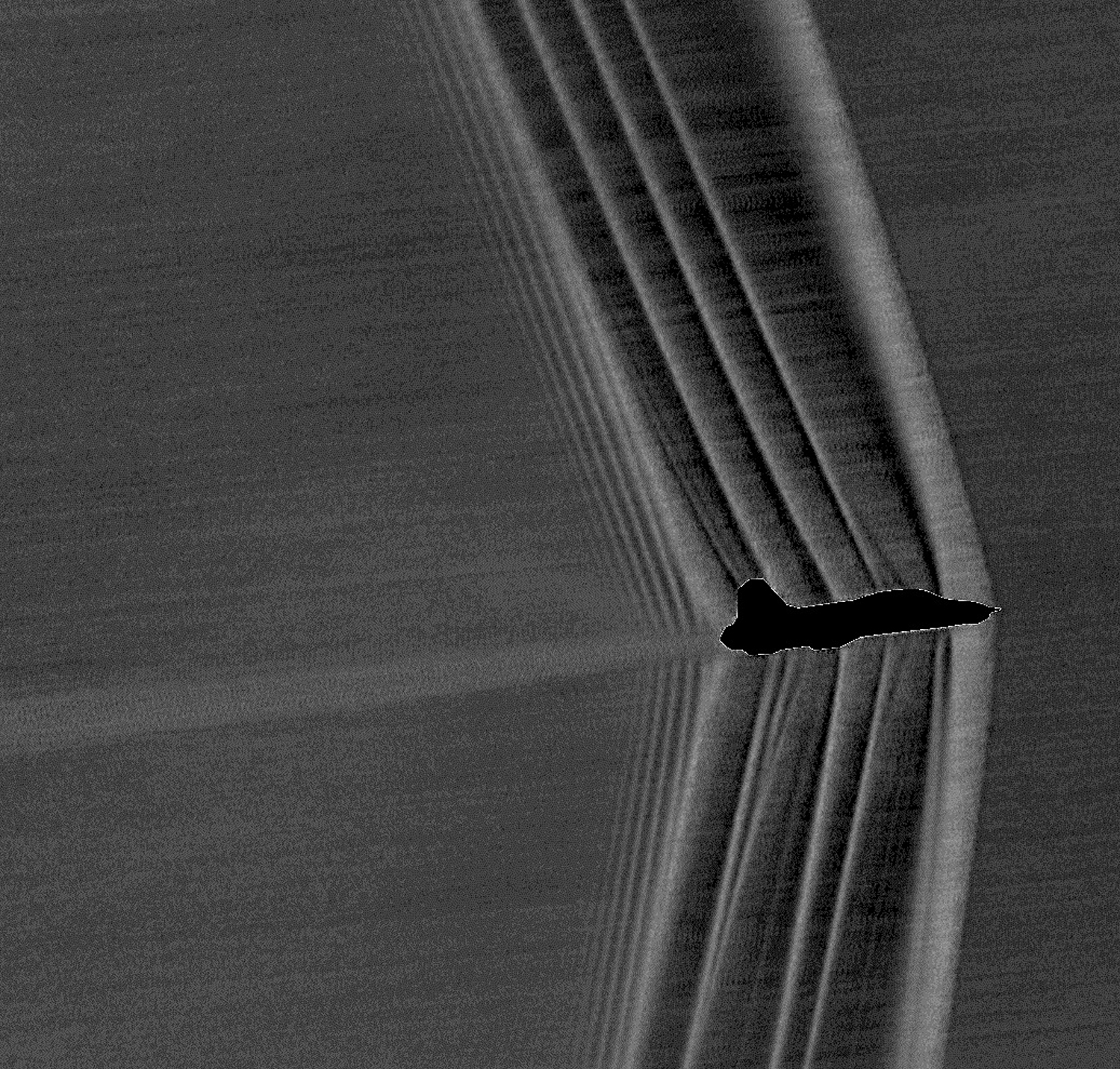 Shockwaves produced by a U.S. Air Force Test Pilot School T-38 banking at Mach 1.05. (NASA)