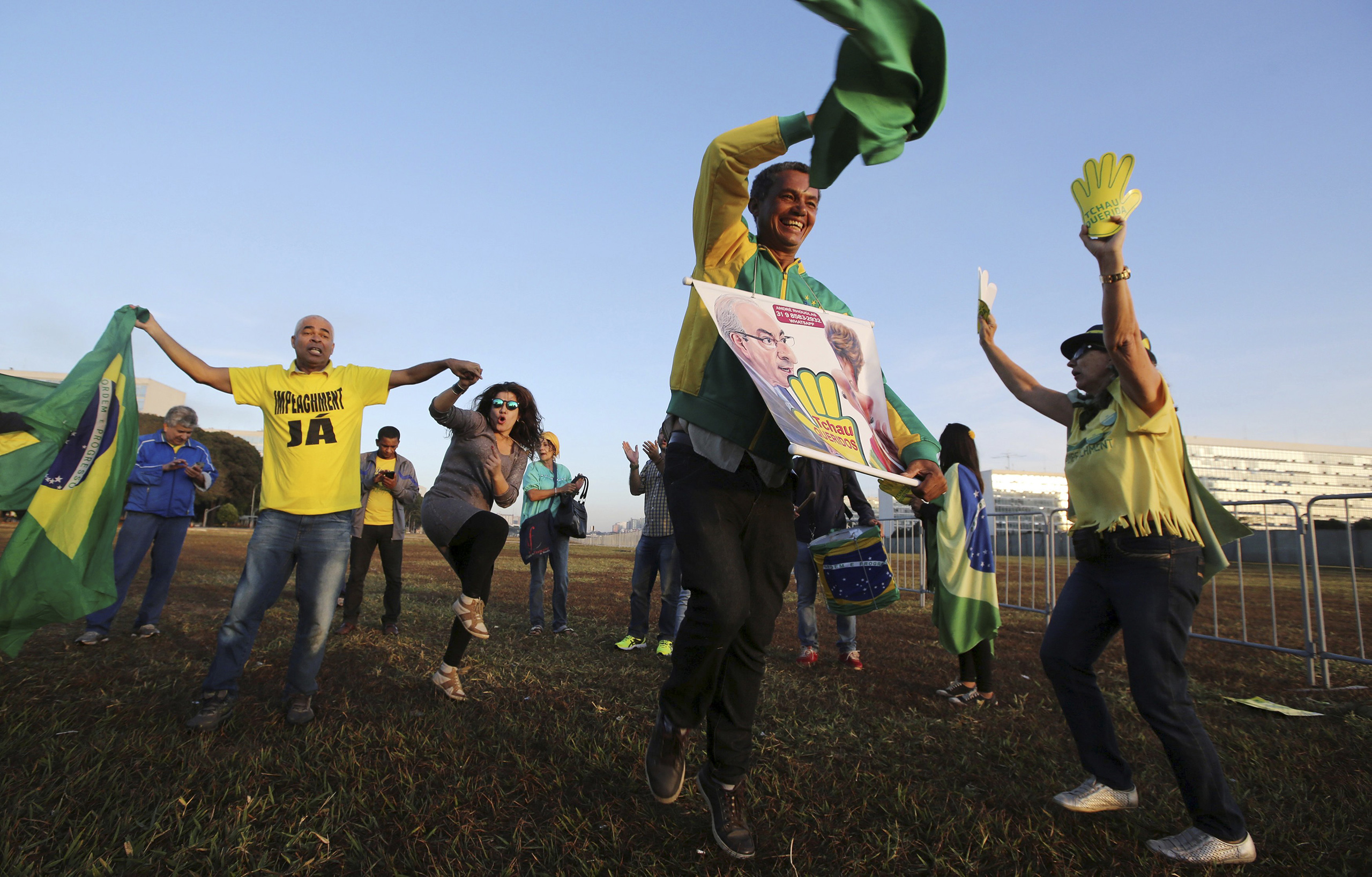 Demonstrators who support Brazil's President Dilma Rousseff's impeachment react in Brasilia, Brazil, May 12, 2016. (Paulo Whitaker—Reuters)