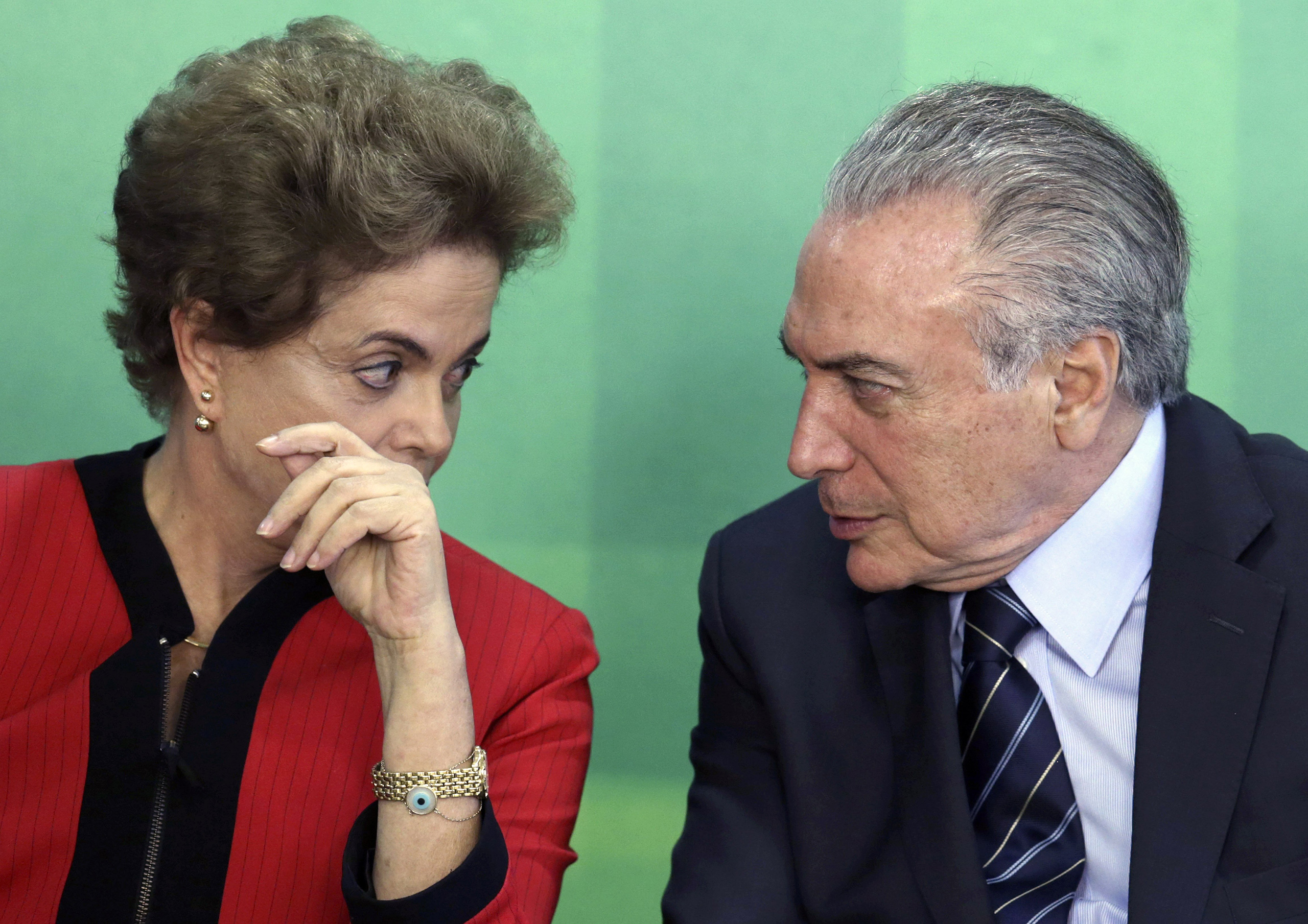 Brazilian President Dilma Rousseff talks with Vice President Michel Temer at Planalto presidential palace in Brasilia, March 2, 2016. (Eraldo Peres—AP)