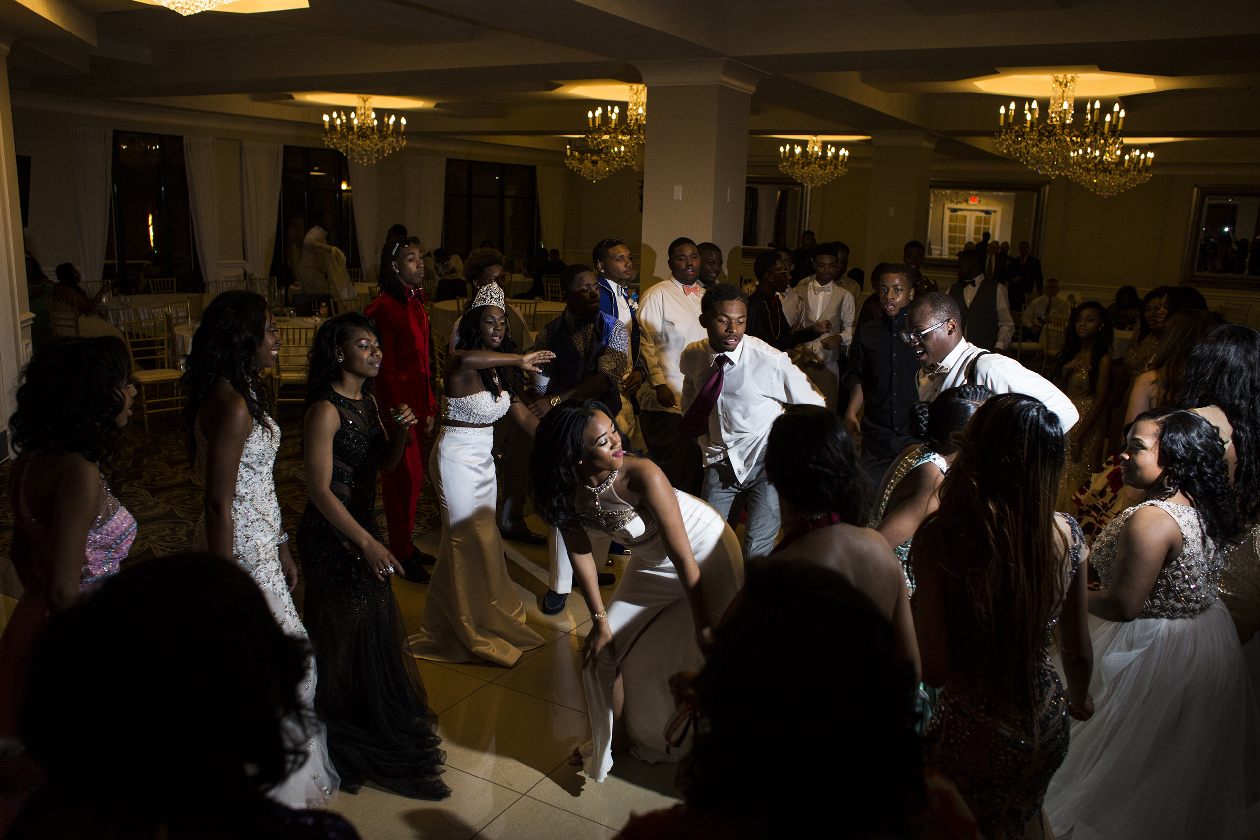 Students dance during a soul train line during prom at the Signature Chop House in Flushing, Mich., May 20, 2016.