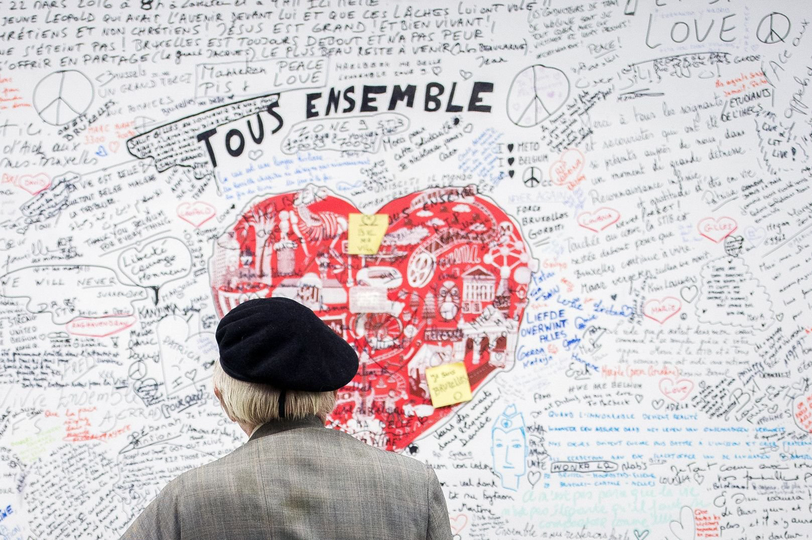A man looks at a memorial panel for the victims of the March 22 attacks at the entrance of the Maelbeek-Maalbeek subway station in Brussels on May 11, 2016. (Laurie Dieffembacq—AFP/Getty Images)