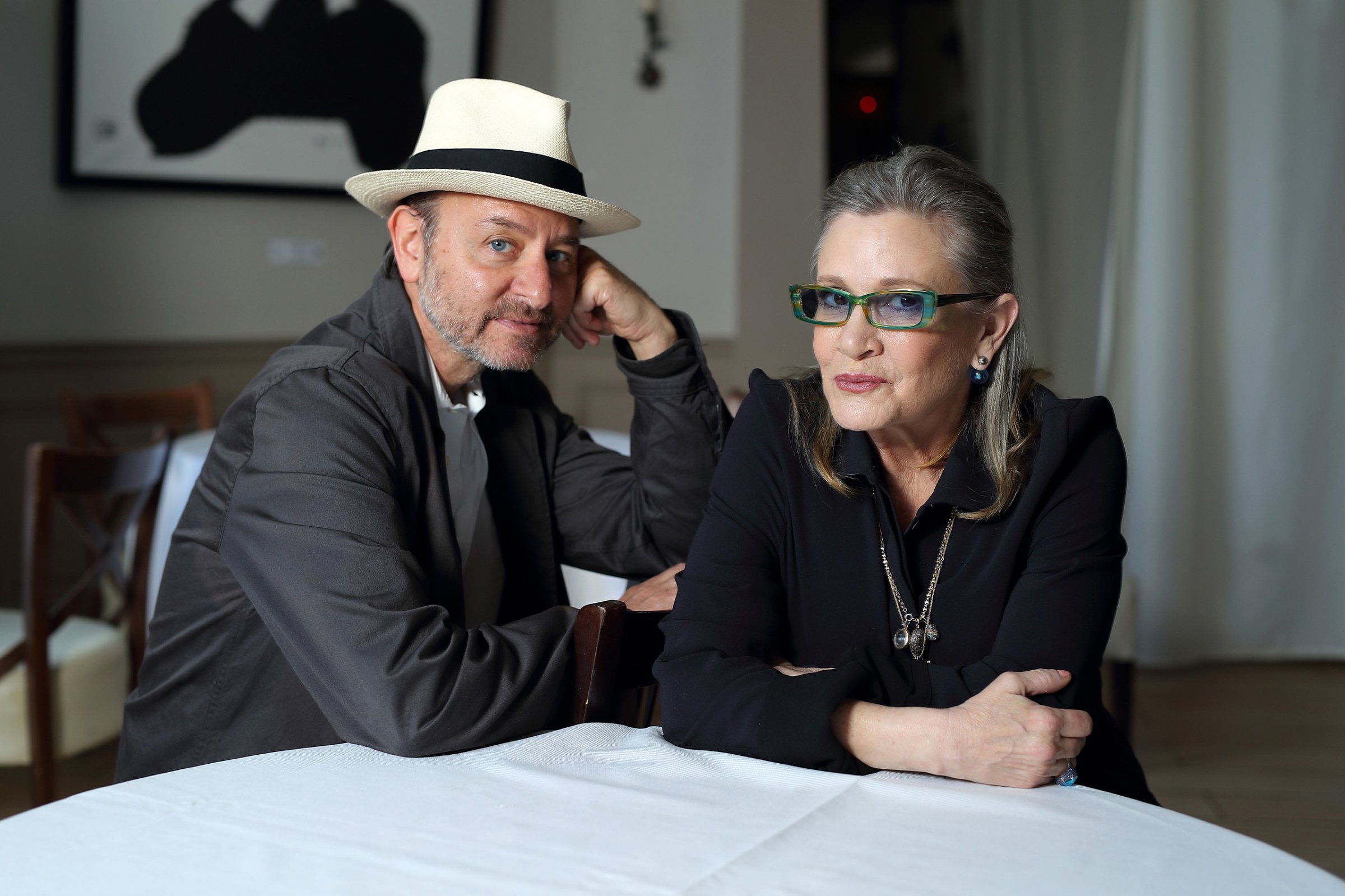 Carrie Fisher and Fisher Stevens attend a photocall for Bright Lights during The 69th Annual Cannes Film Festival at the Palais des Festivals in France on May 15, 2016.