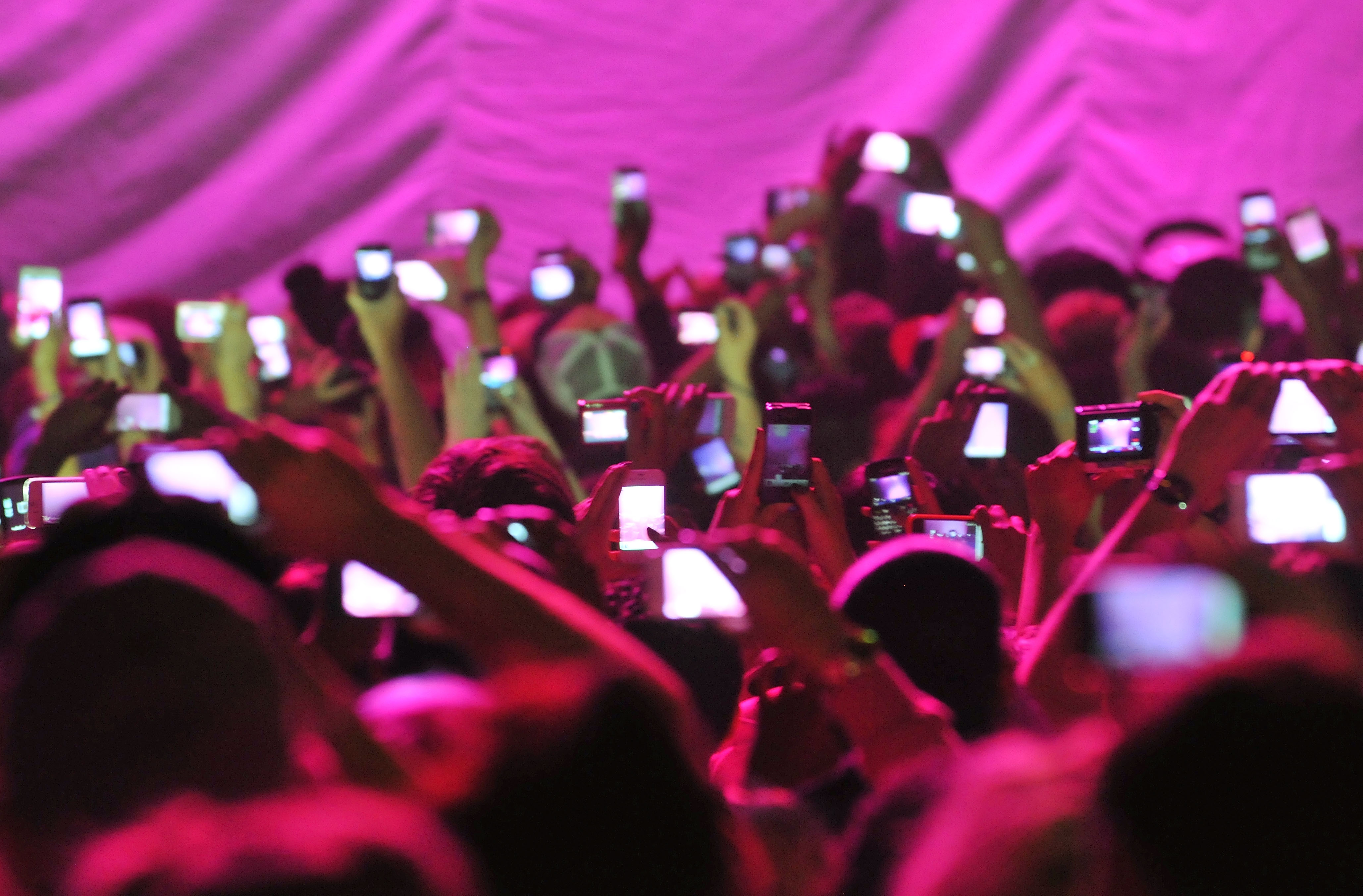 Members of the audience hold up cameras and mobile telephones as American rapper and R&amp;B singer Nicki Minaj takes to the stage stage during her 'Pink Friday' tour at HMV Hammersmith Apollo on June 24, 2012 in London, United Kingdom.