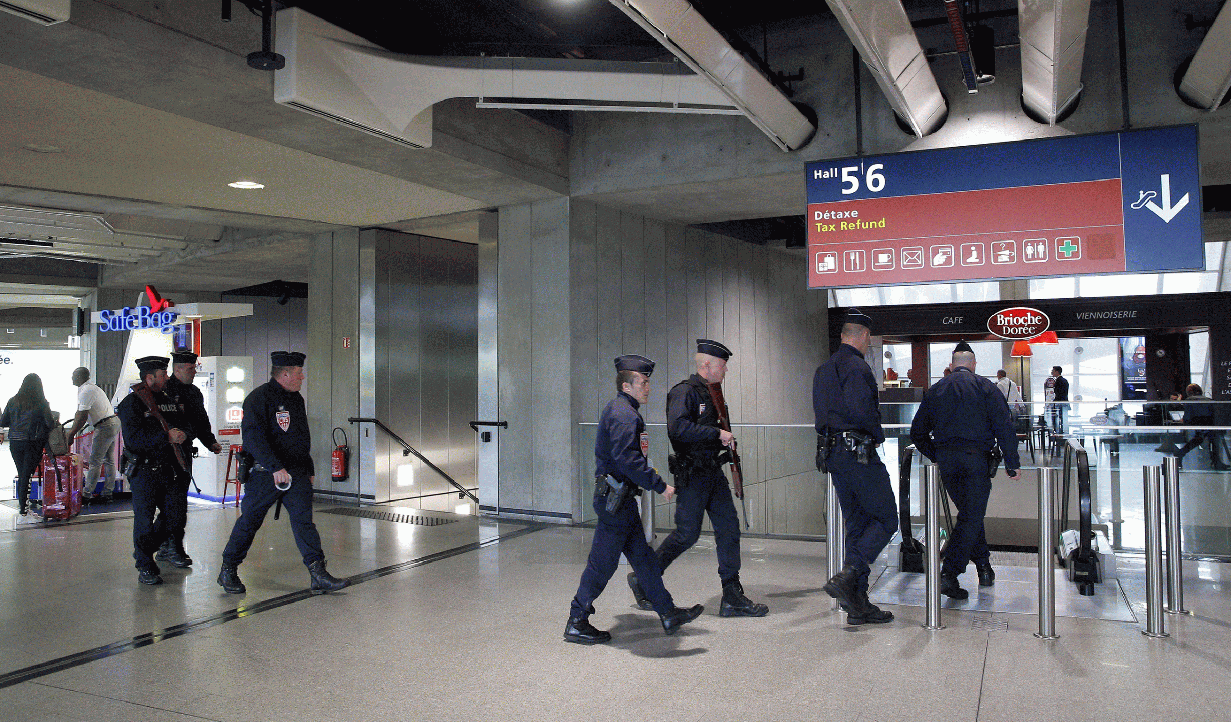 Police officers patrol at Charles de Gaulle airport, outside of Paris, May 19, 2016.