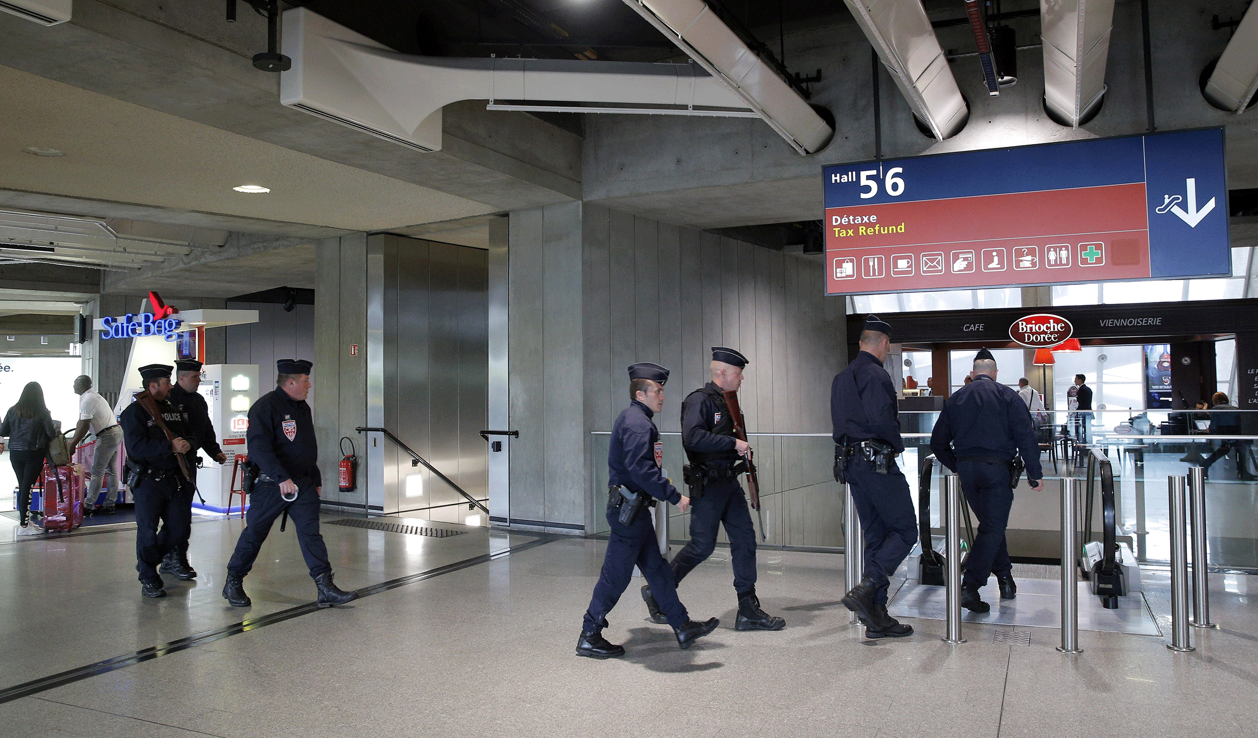 Police officers patrol at Charles de Gaulle airport, outside of Paris, May 19, 2016. (Christophe Ena—AP)