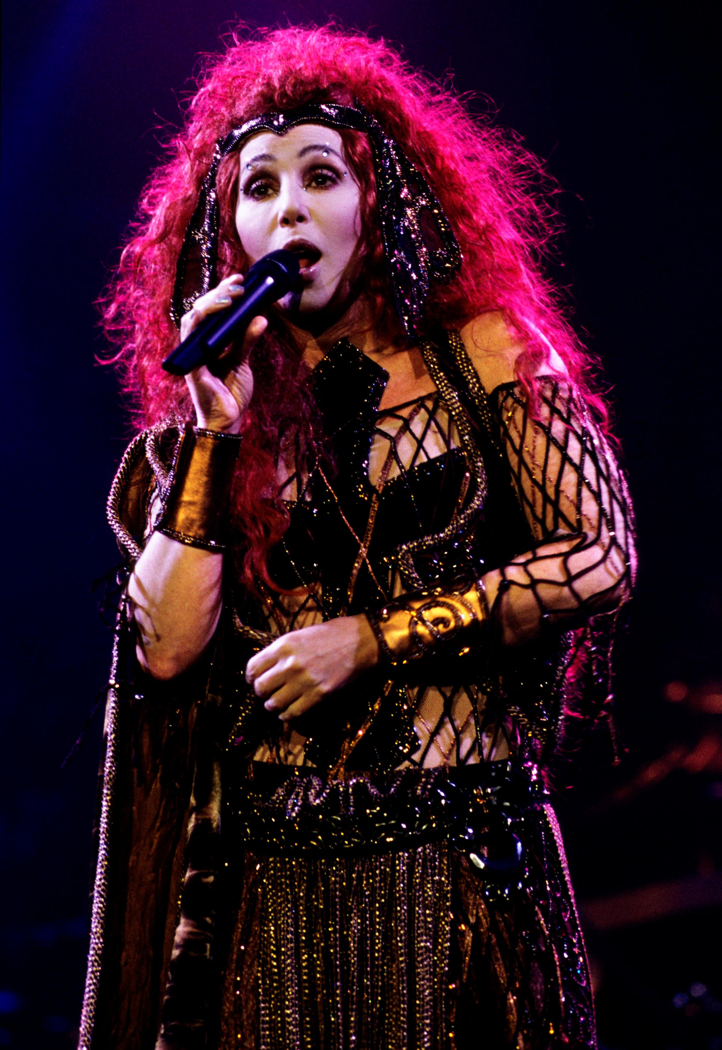 Cher performs during her "Do You Believe?" tour in the U.K. in 1999.