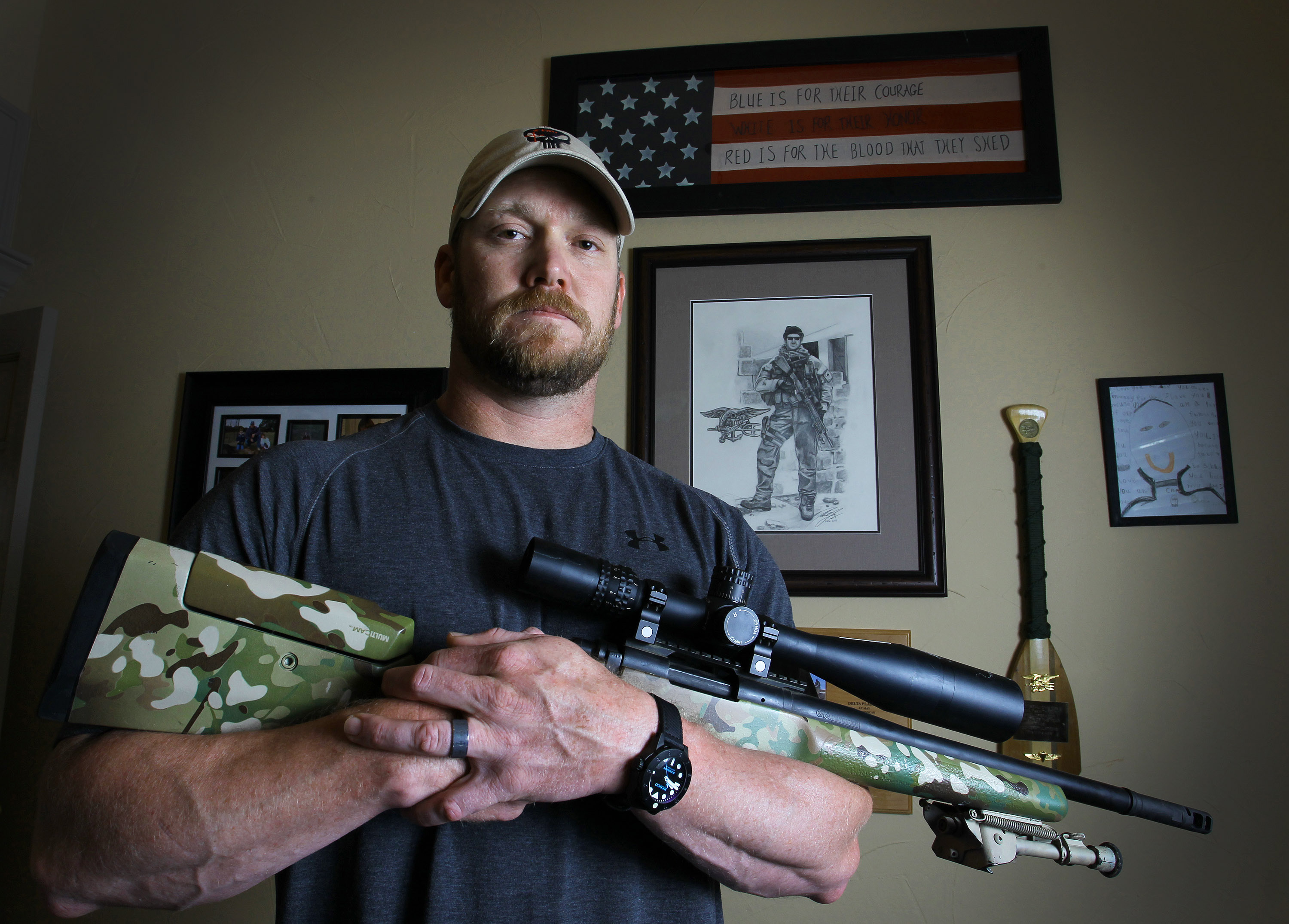 Chris Kyle, a retired Navy SEAL and bestselling author of the book "American Sniper: The Autobiography of the Most Lethal Sniper in U.S. Military History", holds a .308 sniper rifle in this April 6, 2012, photo. (Paul Moseley—Fort Worth Star-Telegram/ Getty Images)