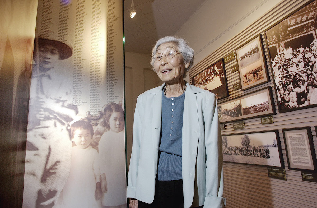 Susan Ahn Cuddy poses at a new museum dedicated to Korean-American immigrants near Los Angeles, Dec. 5, 2003. (Reed Saxon—AP)