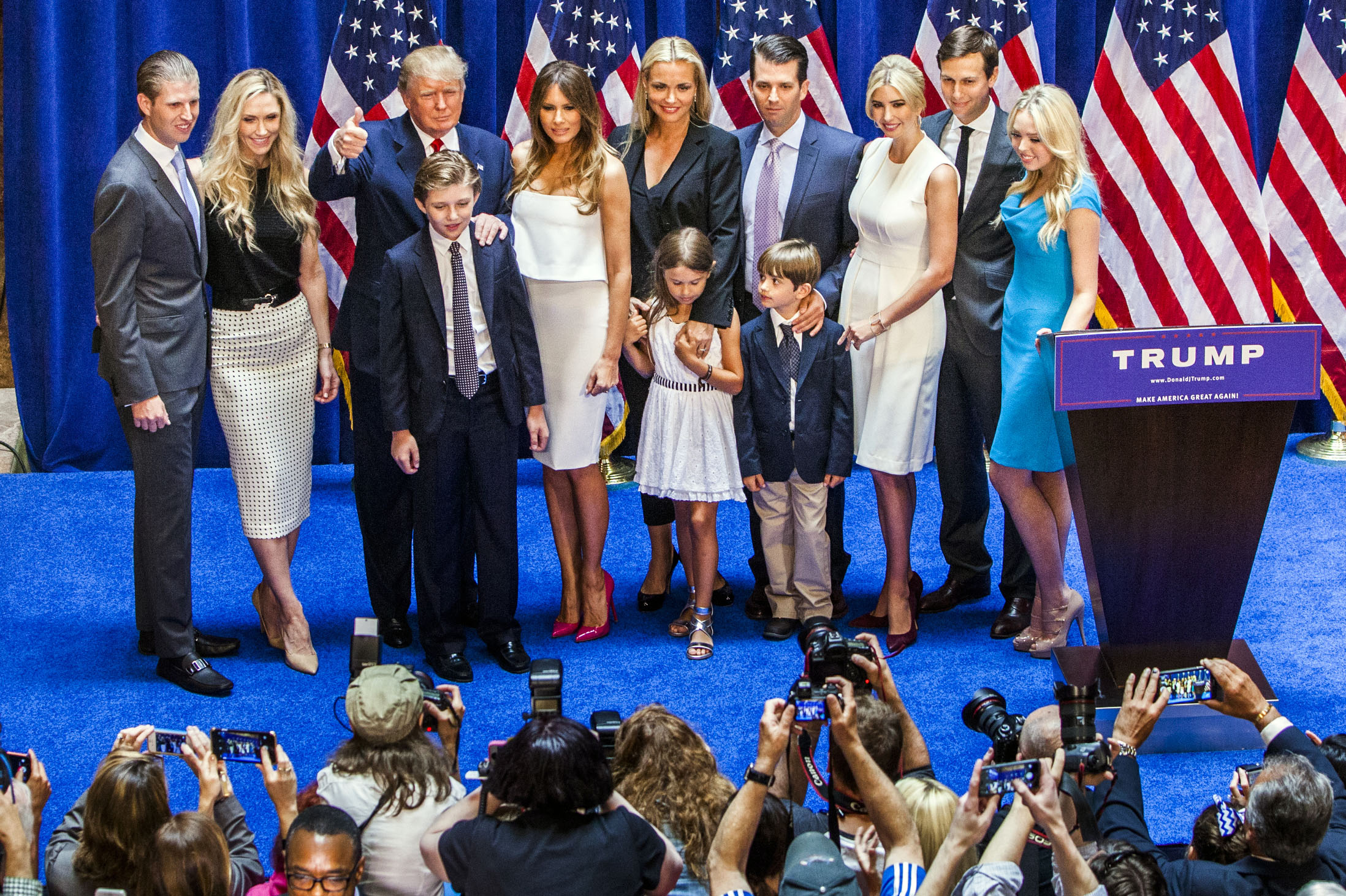 From left, Eric Trump, Lara Yunaska Trump, Donald Trump, Barron Trump, Melania Trump, Vanessa Haydon Trump, Kai Madison Trump, Donald Trump Jr., Donald John Trump III, Ivanka Trump, Jared Kushner and Tiffany Trump appear on stage after Donald Trump announced his candidacy for presidency at Trump Tower on June 16, 2015 in New York. (Christopher Gregory—Getty Images)