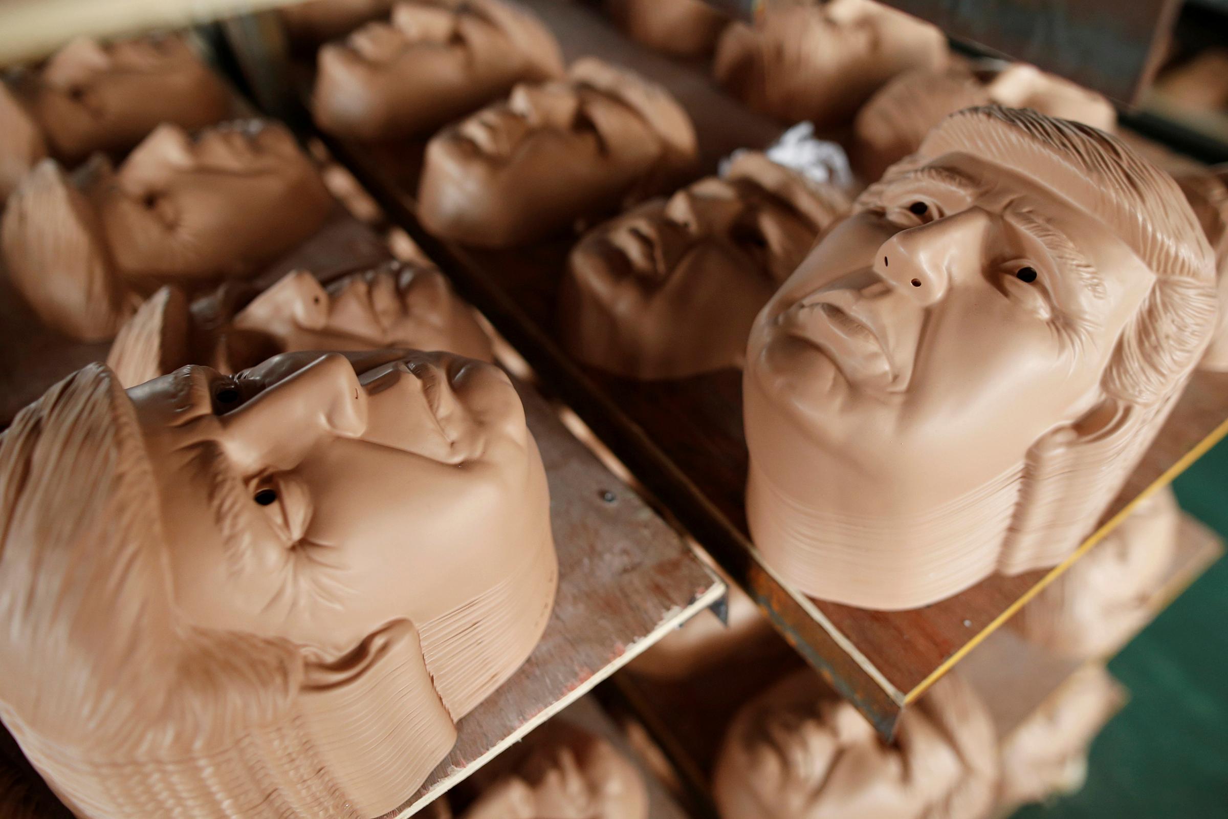 Masks of Republican presidential candidate Donald Trump dry on shelves at Jinhua Partytime Latex Art and Crafts Factory in Jinhua, Zhejiang Province, China, May 25, 2016.