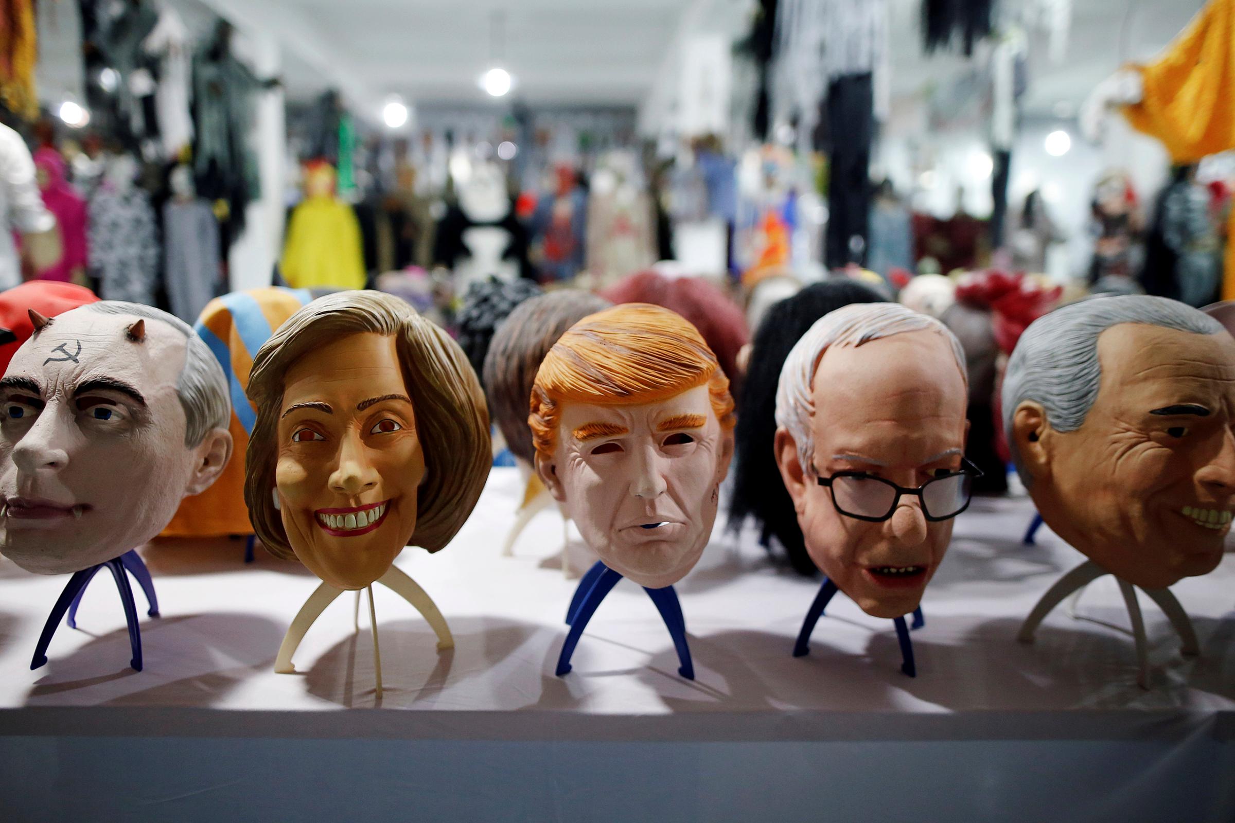 Masks of different politicians are displayed in the showroom of Jinhua Partytime Latex Art and Crafts Factory in Jinhua, Zhejiang Province, China, May 25, 2016.