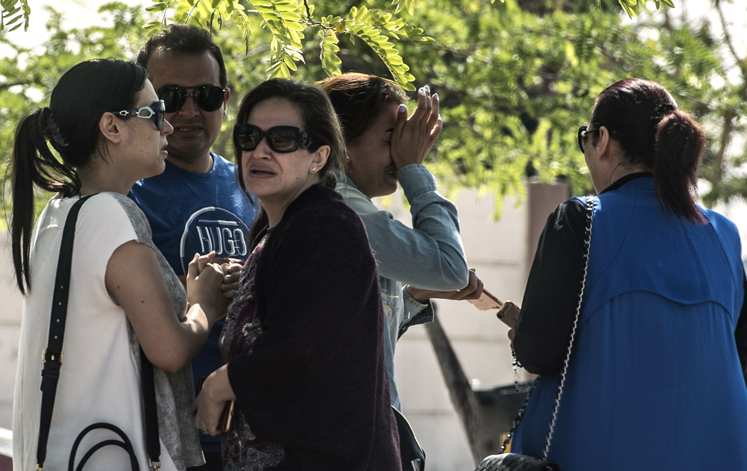 Families of passengers who were flying in an EgyptAir plane that vanished from radar en route from Paris to Cairo wait outside a services hall at the airport in Cairo, May 19, 2016. (Khaled Desouki—AFP/Getty Images)