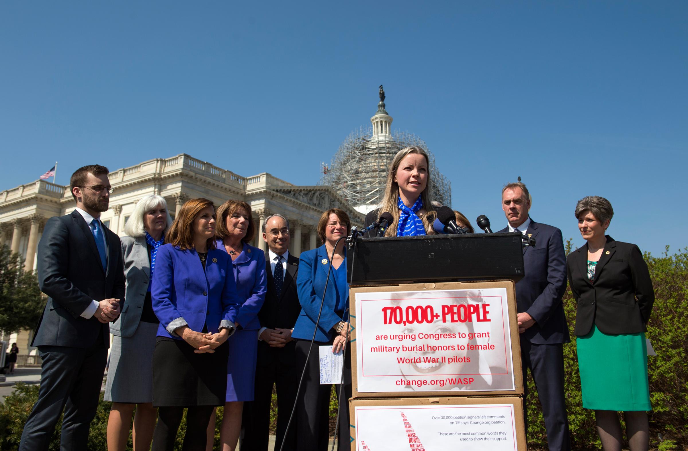 Erin Miller, granddaughter of WWII veteran WASP (Women Airforce Service Pilots), Elaine Harmon, speaks during an event with members of congress on the reinstatement of WWII female pilots at Arlington National Cemetery on Capitol Hill in Washington, Wednesday, March 16, 2016. Arlington National Cemetery approved in 2002 active duty designees, including WASP pilots, for military honors and inurnments. However, in March 2015, then-Secretary of the Army John McHugh reversed this decision. (AP Photo/Molly Riley)