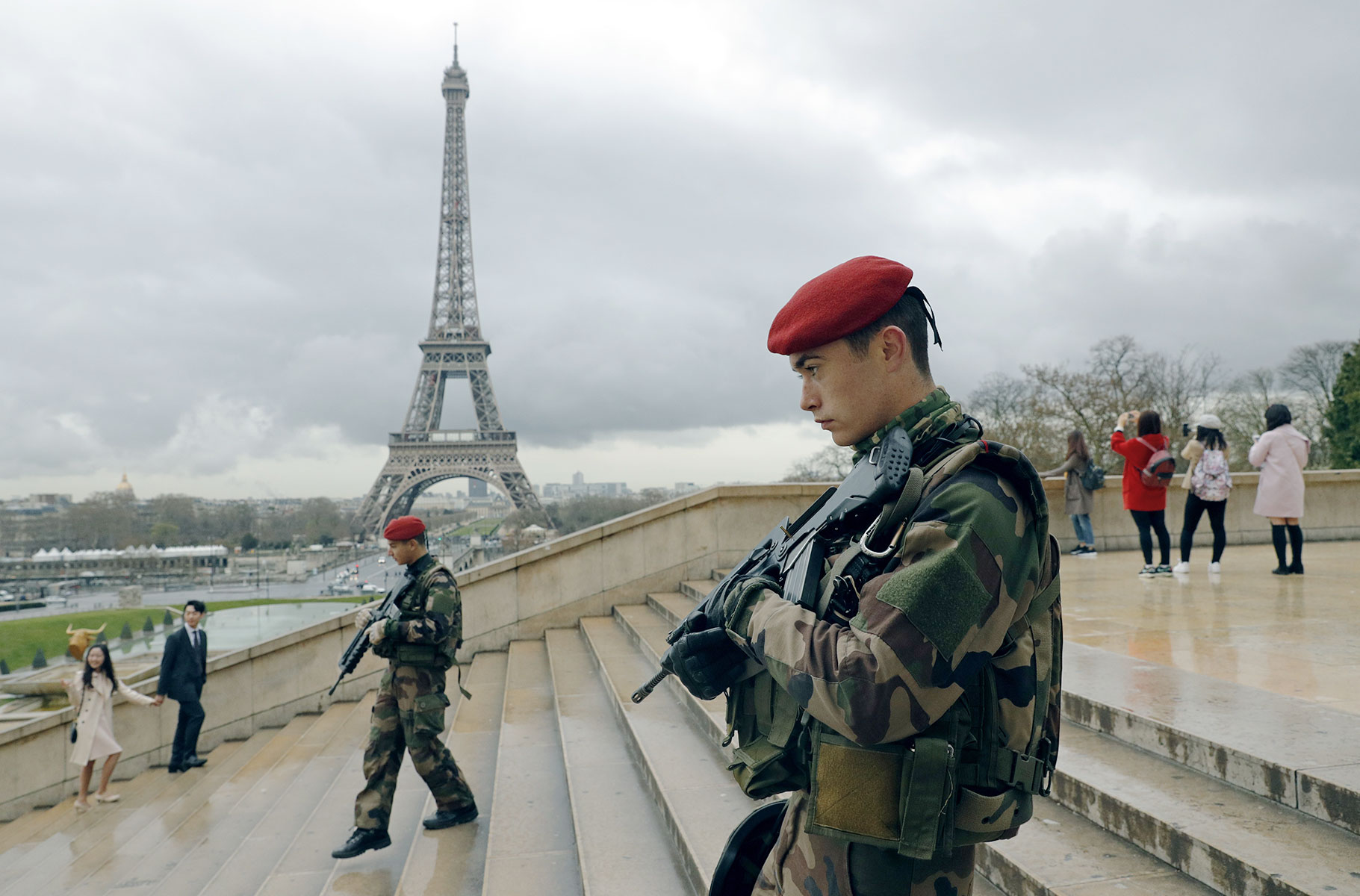 French paratroopers patrol near the Eiffel Tower on March 30 as part of a major security surge