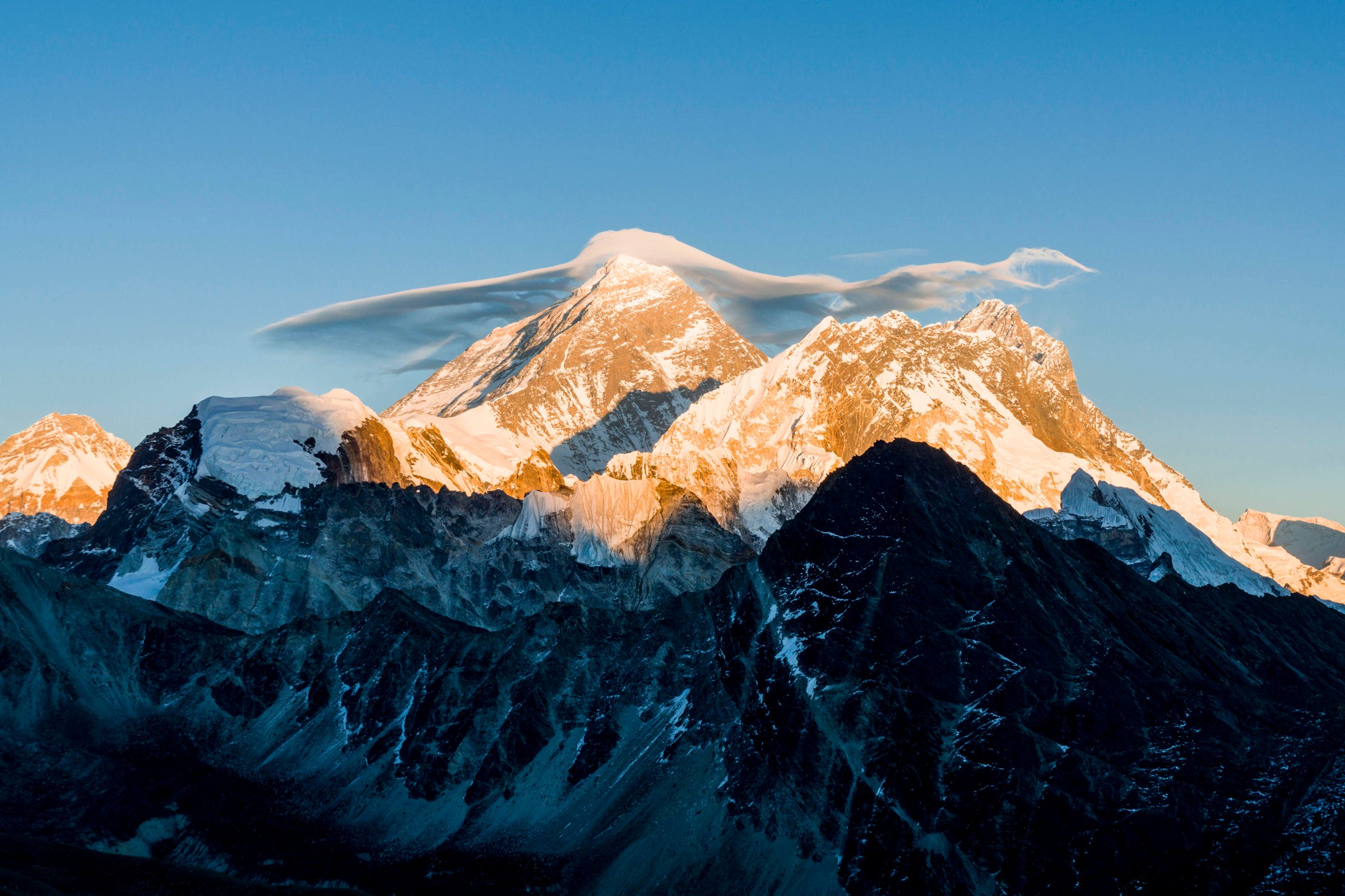 The mountain Mt. Everest (8848m) with a white cloud on top, seen from Gokyo Ri (5360m) at sunset.
