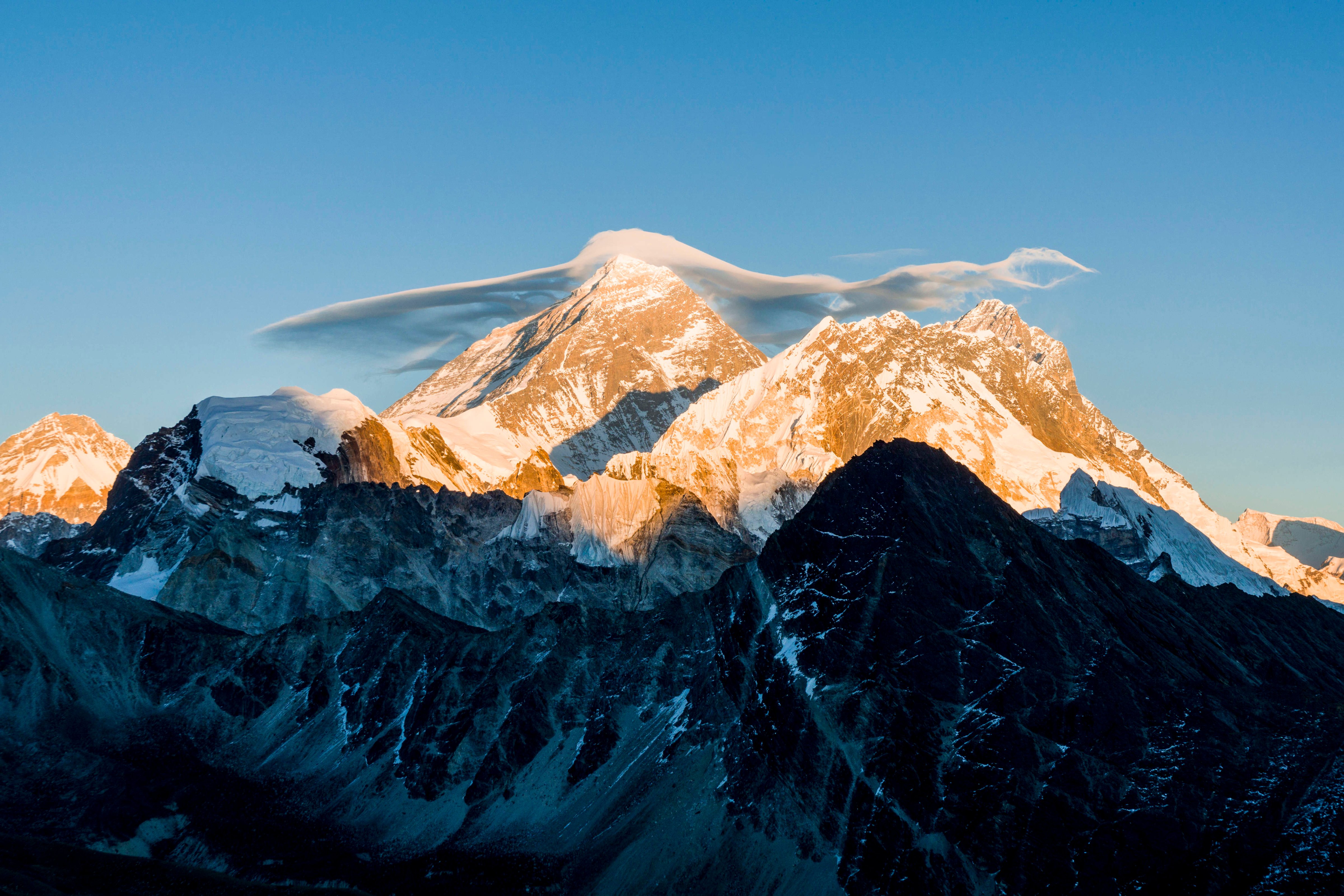 The mountain Mt. Everest (8848m) with a white cloud on top, seen from Gokyo Ri (5360m) at sunset. (Frank Bienewald—LightRocket/Getty Images)