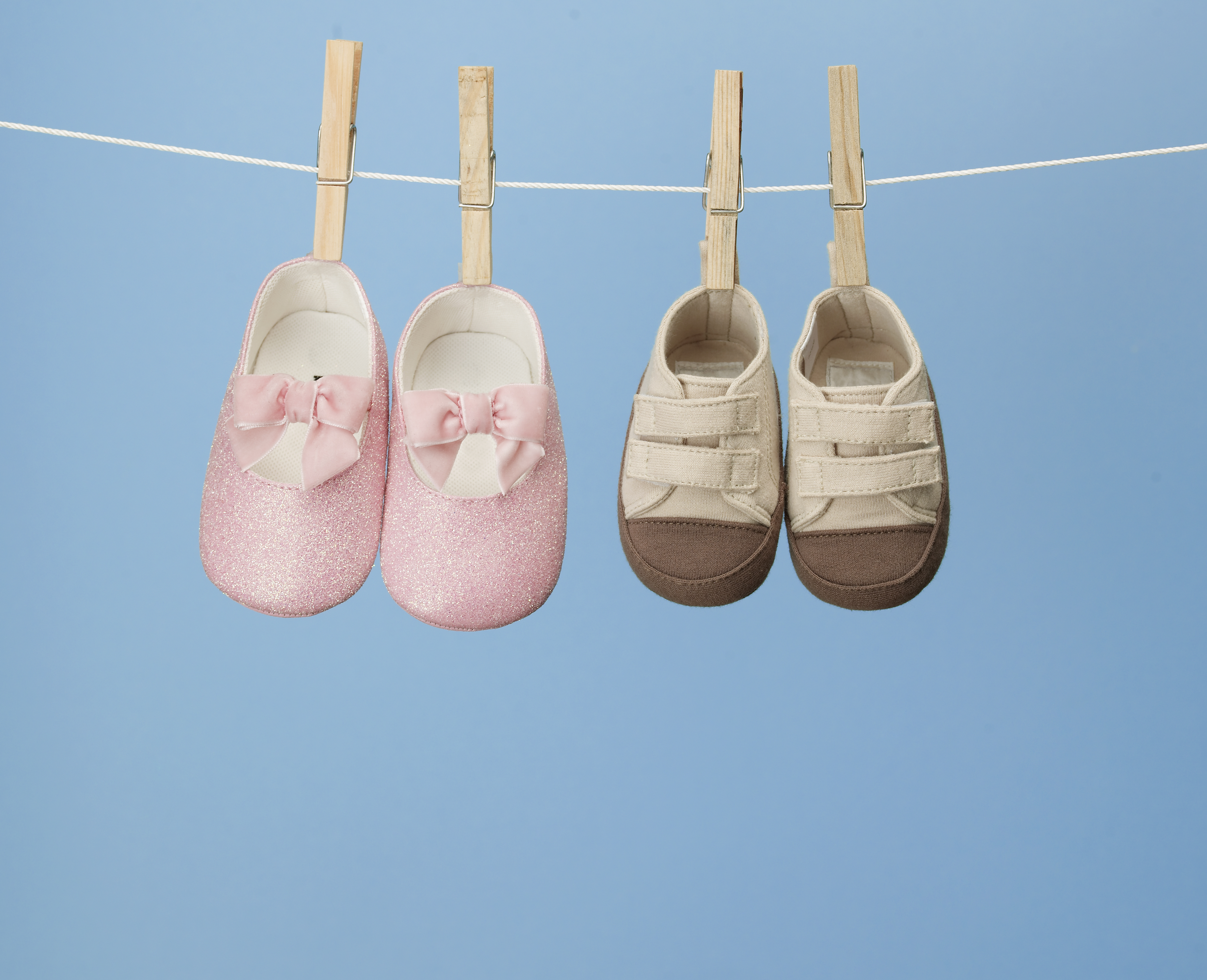 Two Pairs of Shoes on Clothes Line