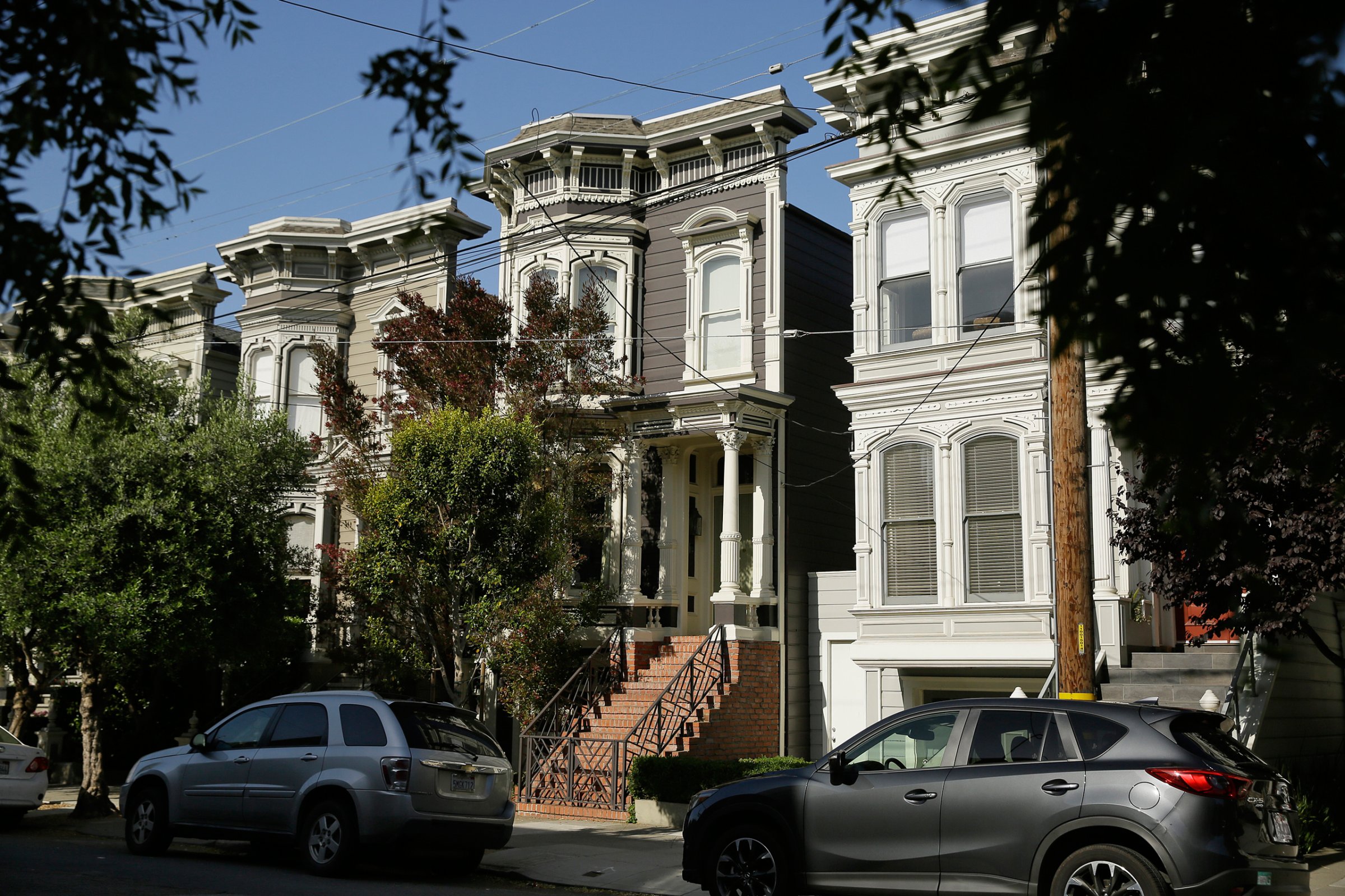 A Victorian home, center, made famous by the television show "Full House" is seen Friday, May 27, 2016, in San Francisco. The three bedroom home dating from 1883 is now for sale at $4.15 million. (AP Photo/Eric Risberg)