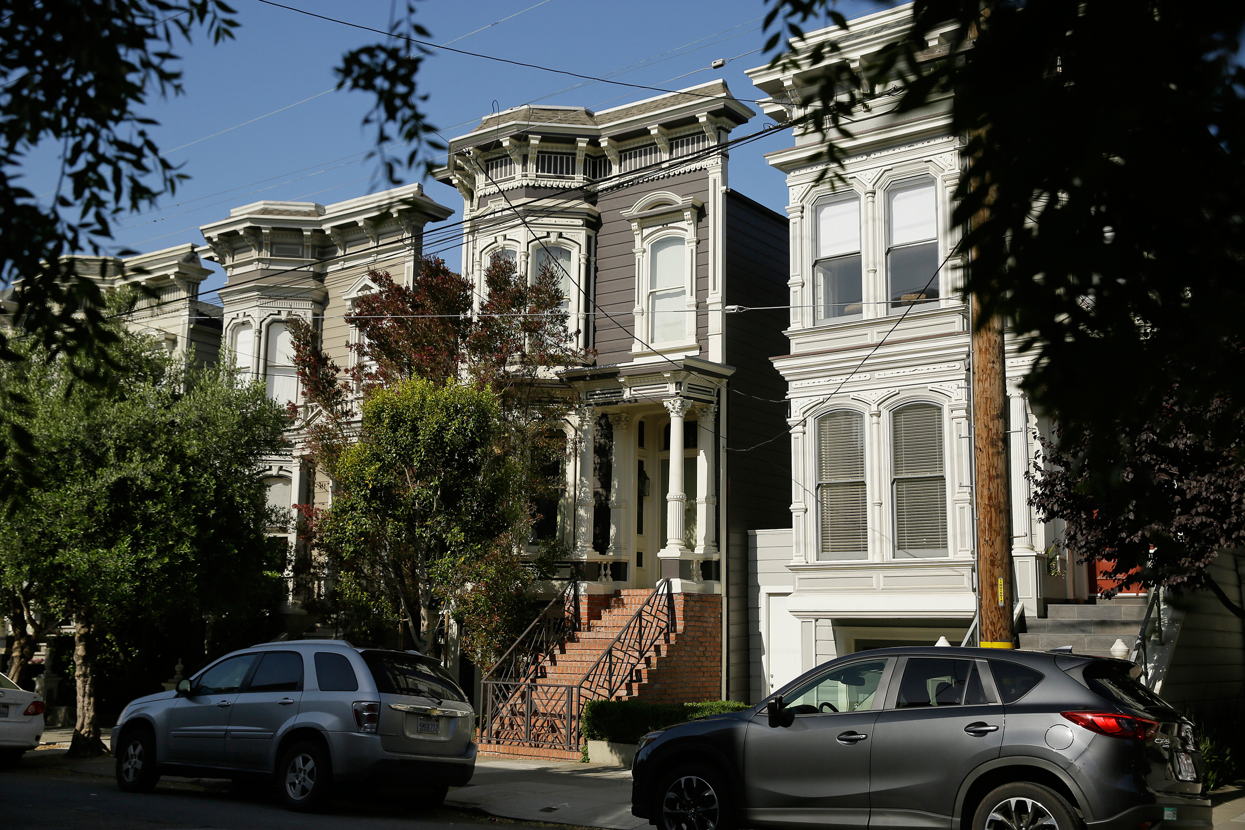 A Victorian home, center, made famous by the television show "Full House" is seen Friday, May 27, 2016, in San Francisco. The three bedroom home dating from 1883 is now for sale at $4.15 million. (Eric Risberg—AP)