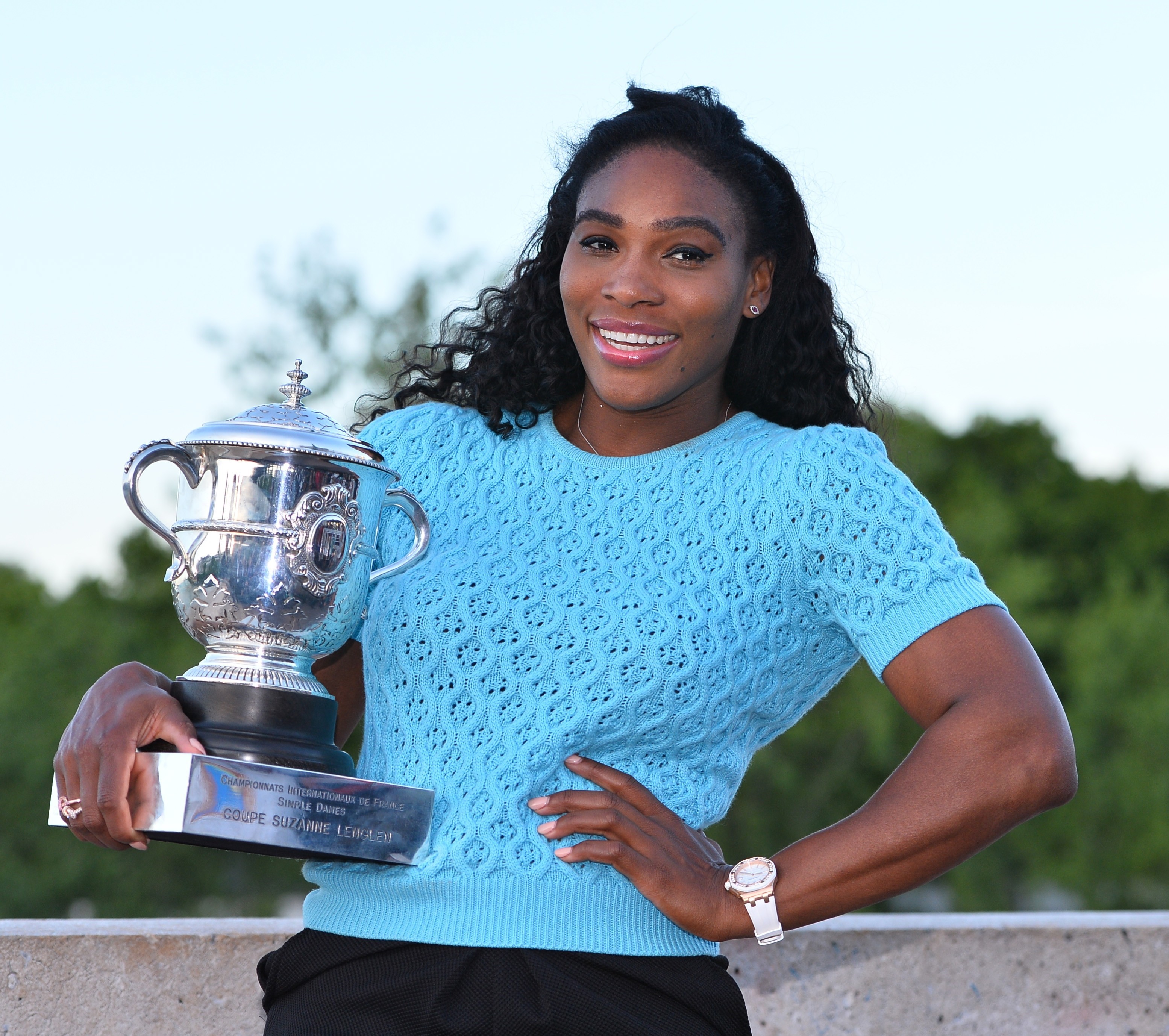 Serena Williams poses with the winner's trophy at the Bir-Hakeim bridge after winning the women's final of the French Open tennis championships at Roland Garros in Paris, France on June 6, 2015. (Anadolu Agency&mdash;Getty Images)