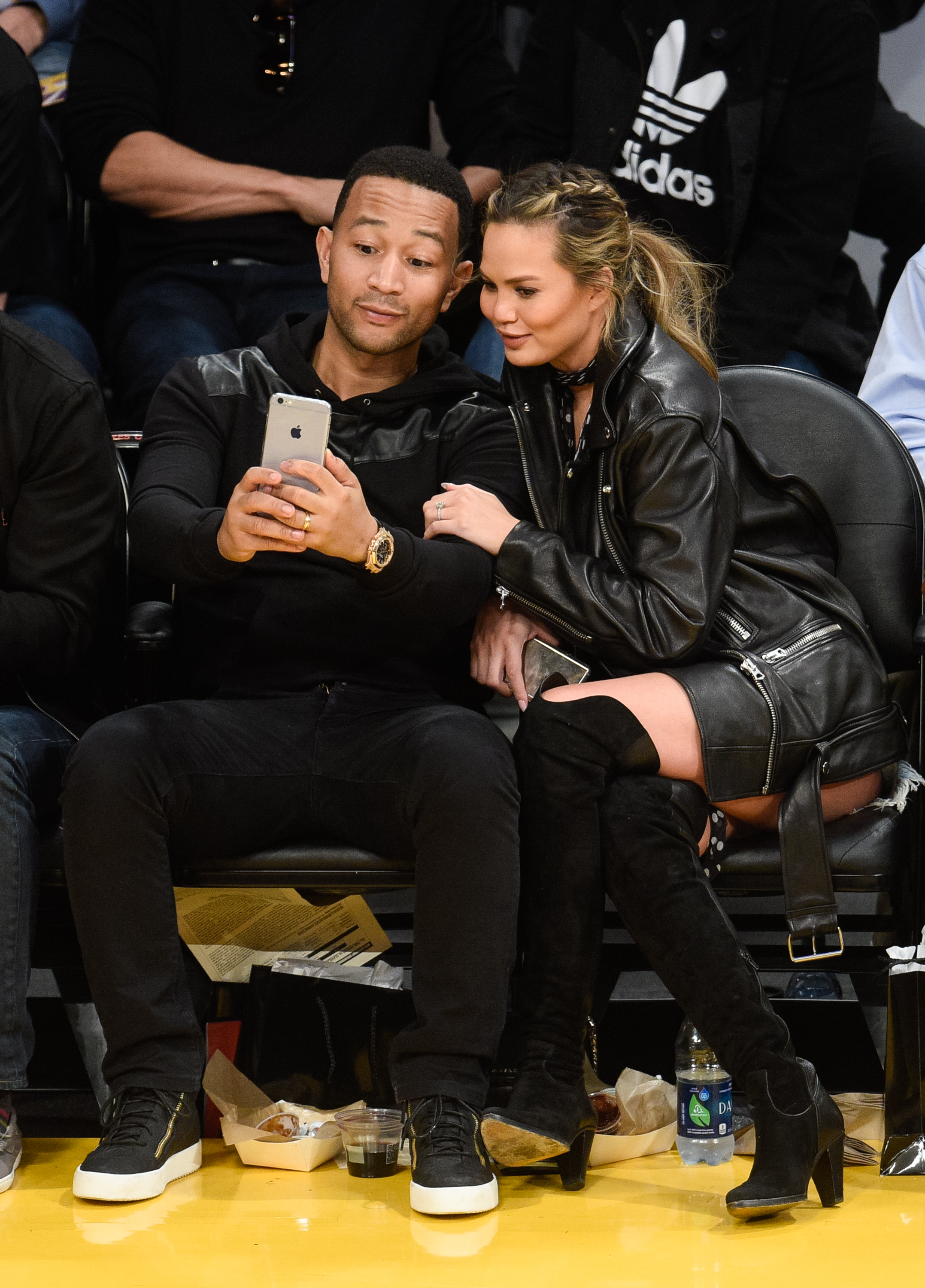 John Legend and Chrissy Teigen at a basketball game in Los Angeles on March 10, 2016. (Noel Vasquez—GC Images)