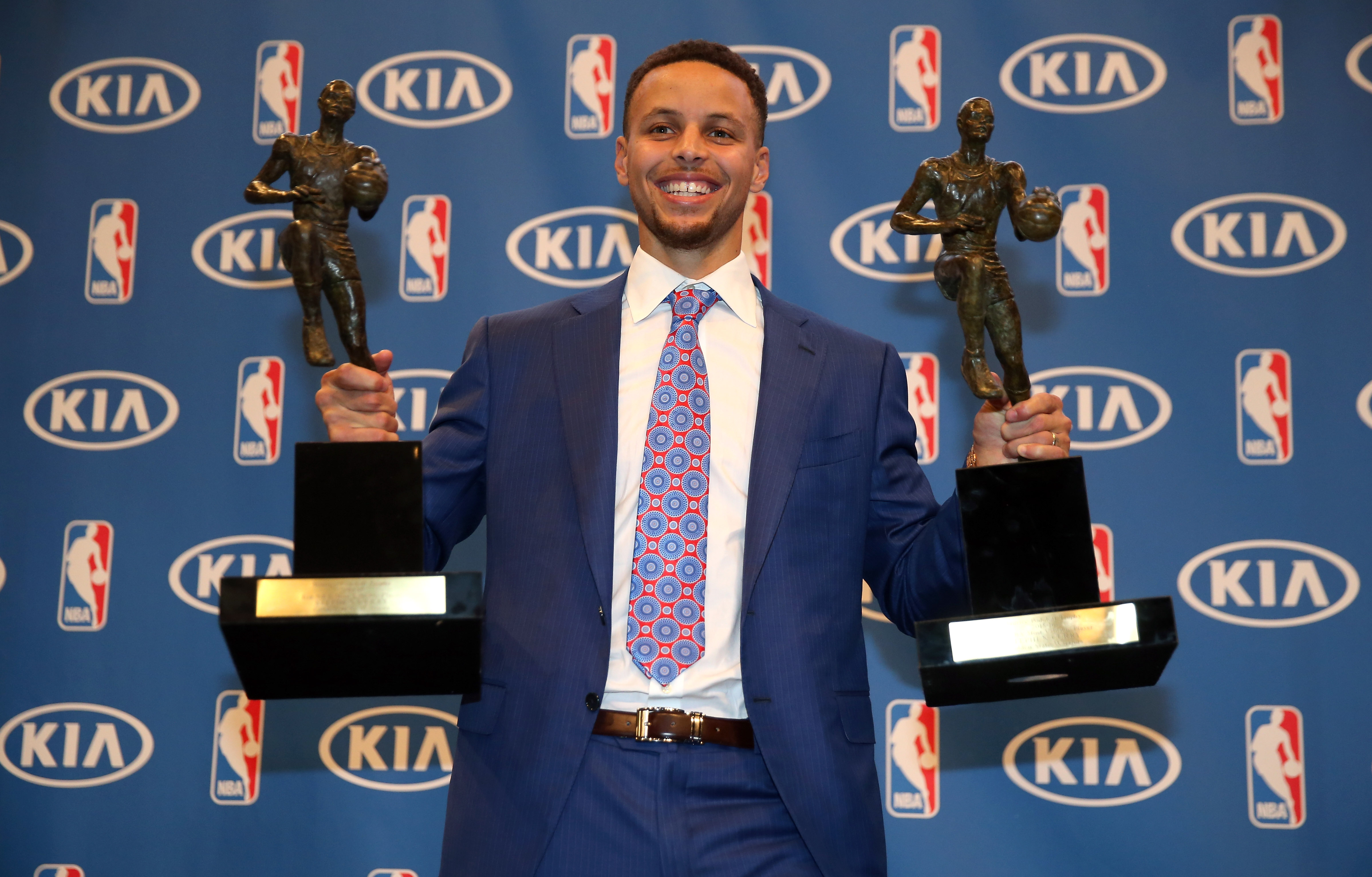 Stephen Curry of the Golden State Warriors poses with his back-to-back NBA Most Valuable Player Awards following a press conference at ORACLE Arena on May 10, 2016 in Oakland, California. (Ezra Shaw&mdash;Getty Images)