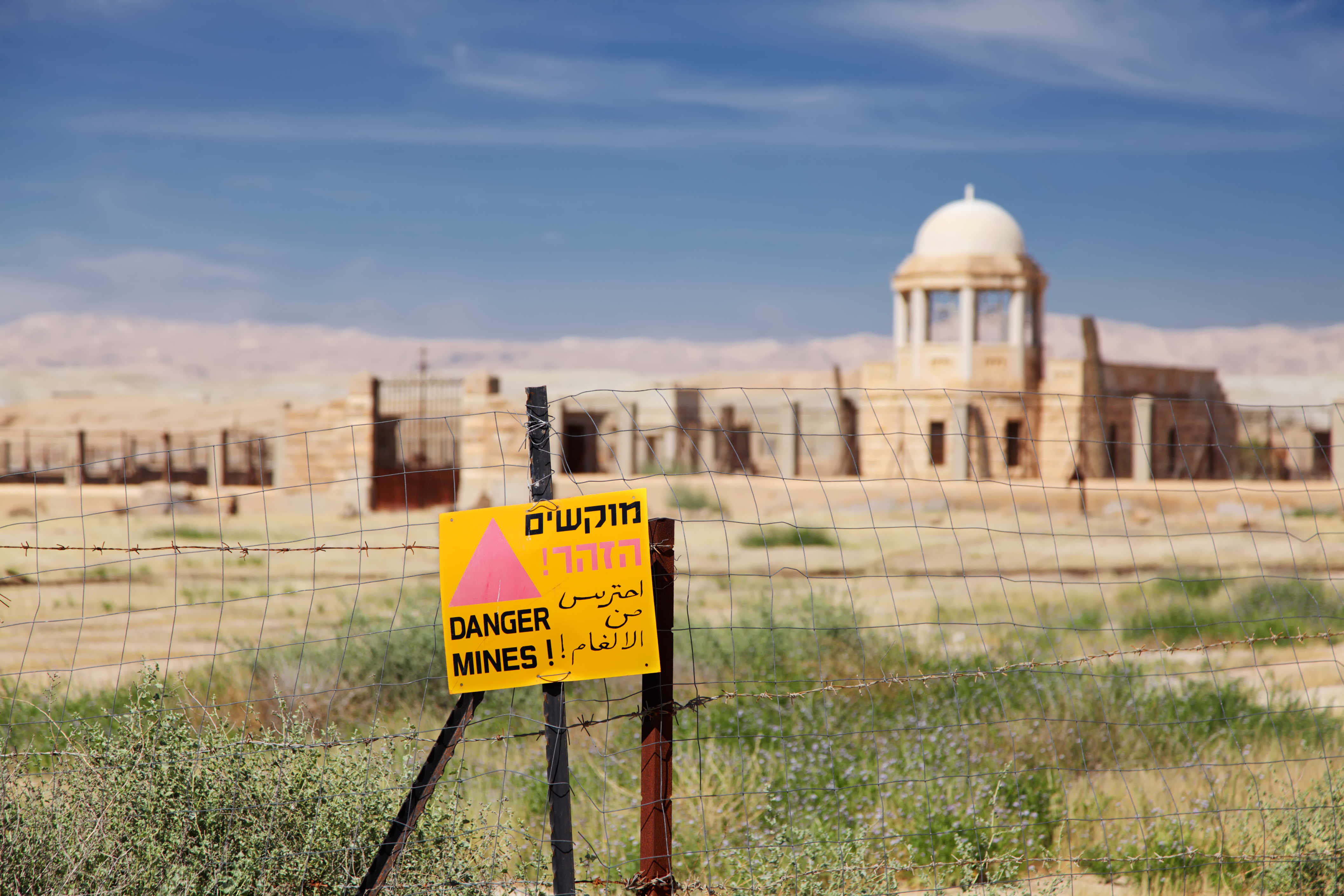 A danger sign on a fence at the Qasr-el-Yahud site. (Alexander Gatsenko—iStockphoto/Getty Images)