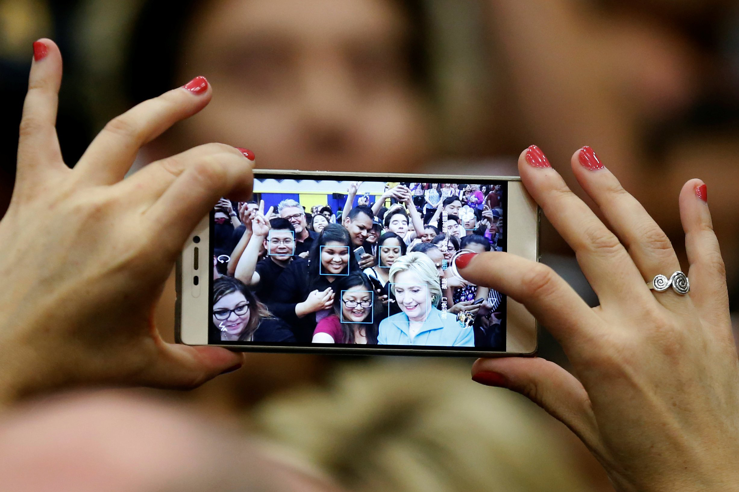 Democratic presidential candidate Hillary Clinton takes a selfie with supporters after speaking at the University of California Riverside in Riverside, Calif., on May 24, 2016. (Lucy Nicholson—Reuters)