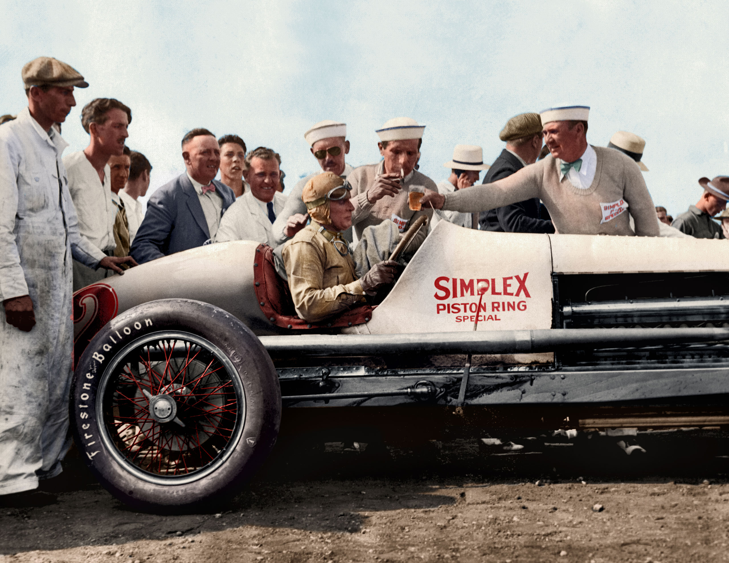 Race car driver Ray Keech in his Simplex Piston Ring Special #2 race car after winning the Indy 500. Indianapolis, Indiana, 1929.