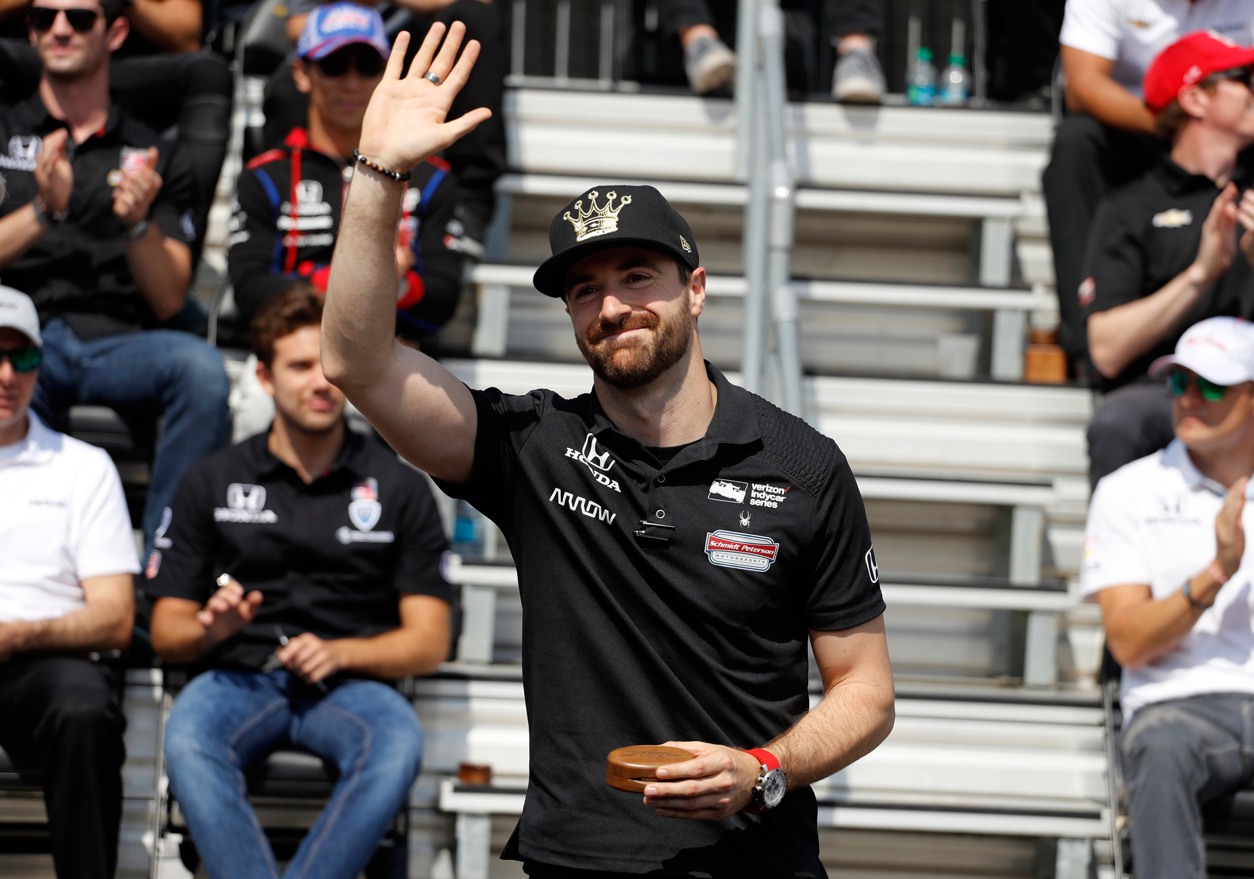 Pole sitter James Hinchcliffe, of Canada, waves to fans during the drivers meeting for the Indianapolis 500 auto race at Indianapolis Motor Speedway in Indianapolis on May 28, 2016. (Jeff Roberson—AP)