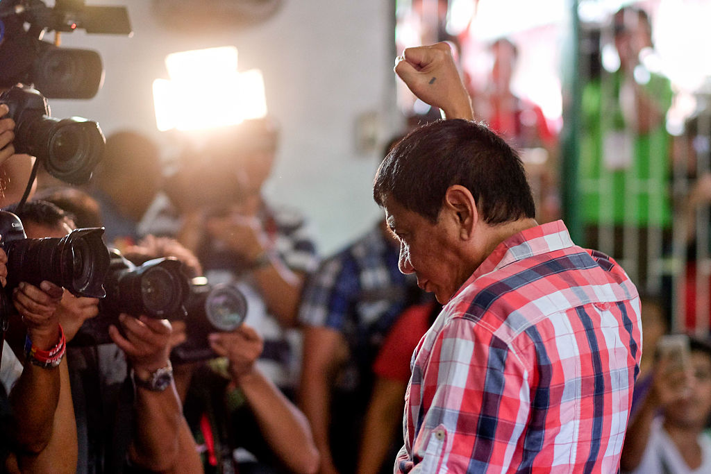 Rodrigo Duterte, Mayor of Davao and presidential candidate, gestures to members of the media at a polling station during the presidential election in Davao, Mindanao, the Philippines on May 9, 2016. (Bloomberg&mdash;Bloomberg via Getty Images)